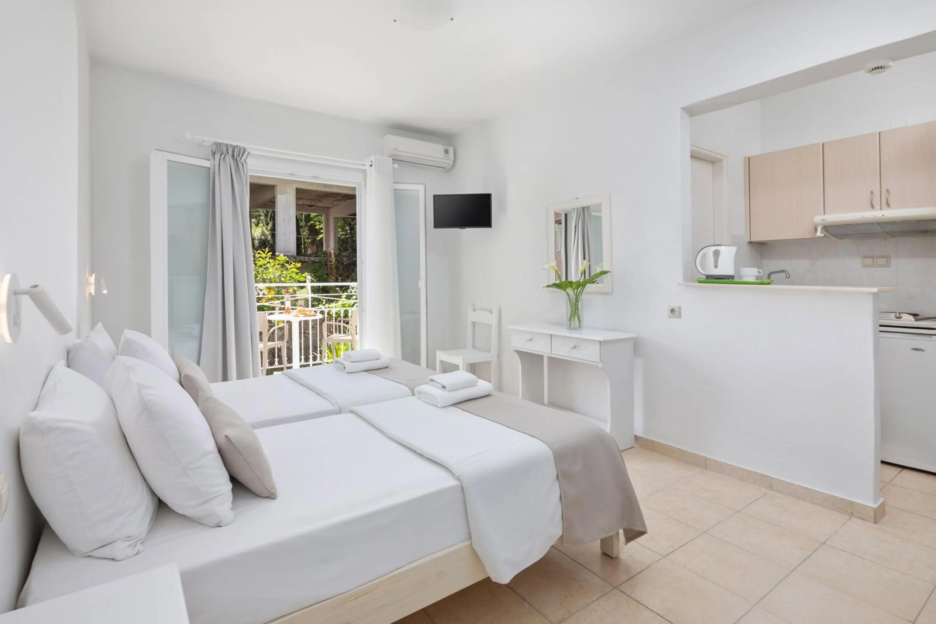 Bed in Bella Vista Beach Hotel