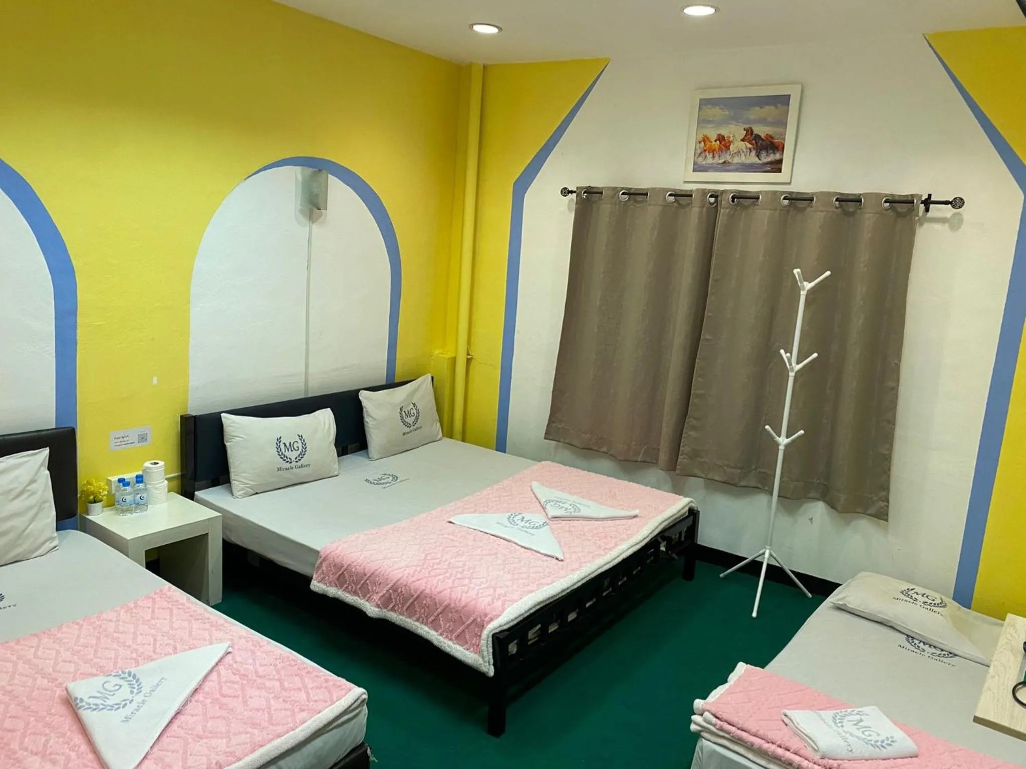 Bed in Miracle Gallery Hotel