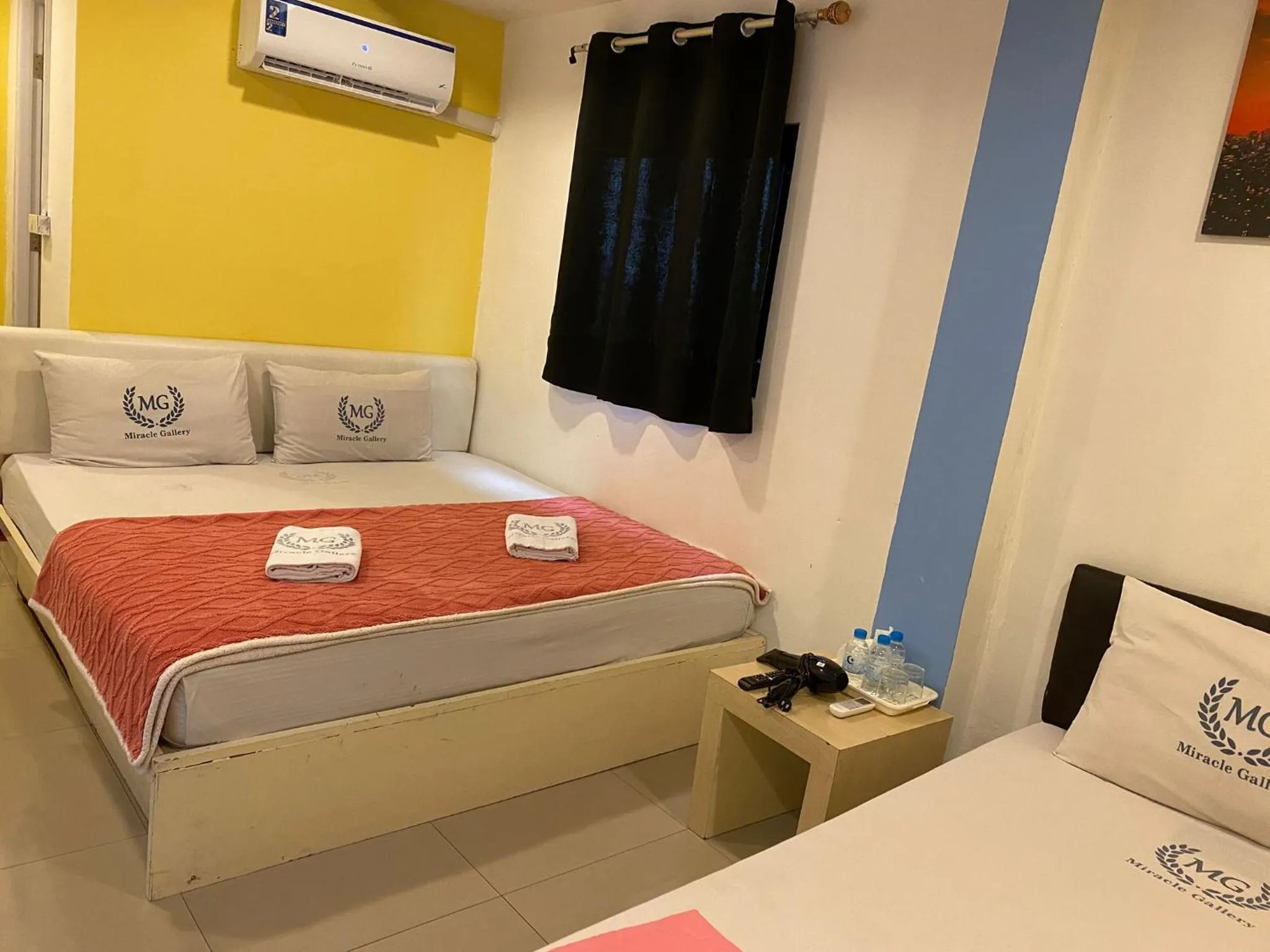 Bed in Miracle Gallery Hotel