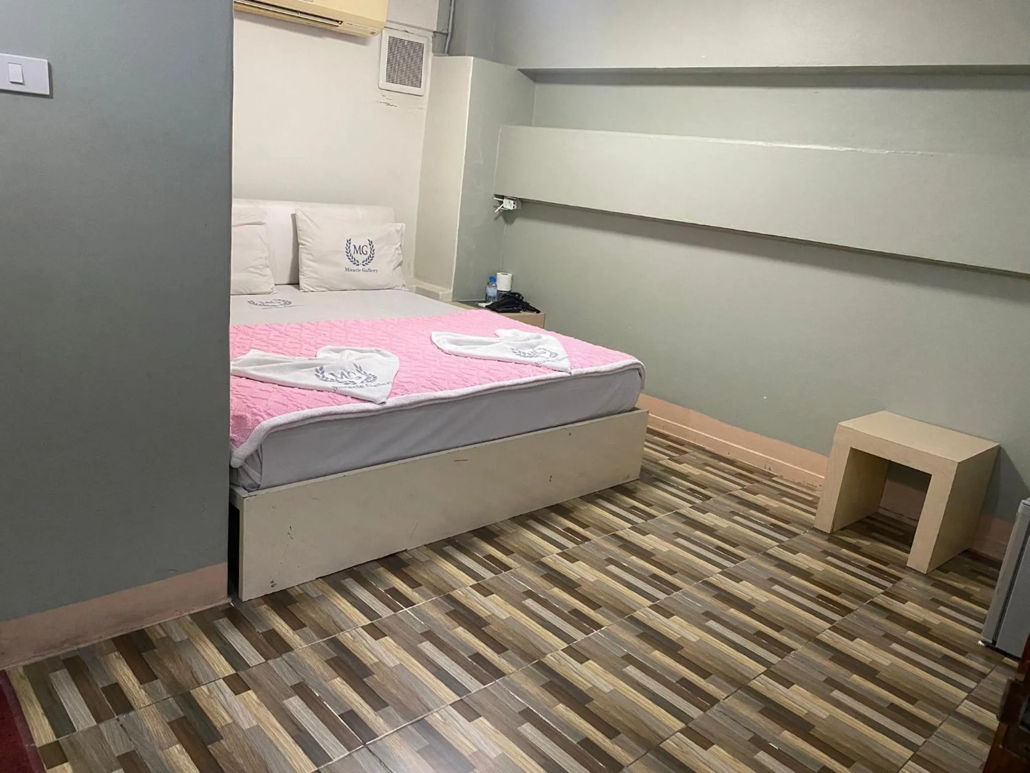 Bed in Miracle Gallery Hotel