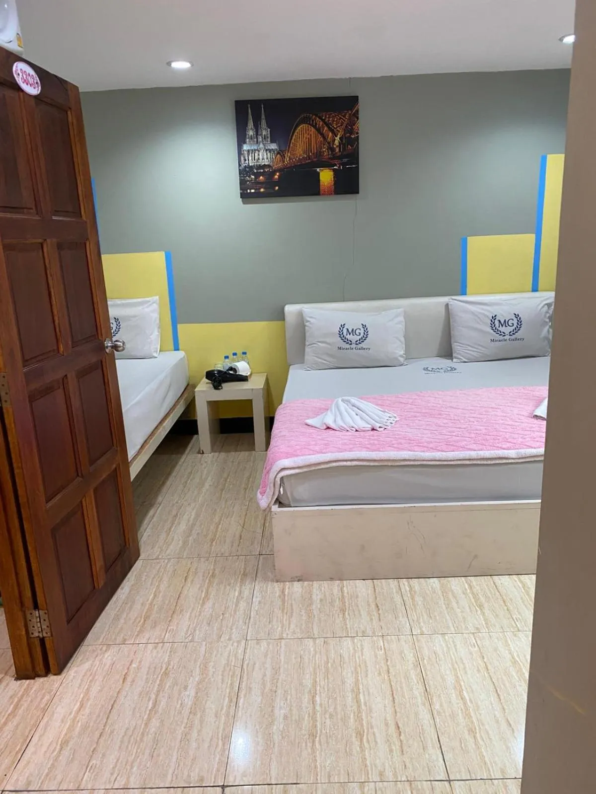 Bed in Miracle Gallery Hotel