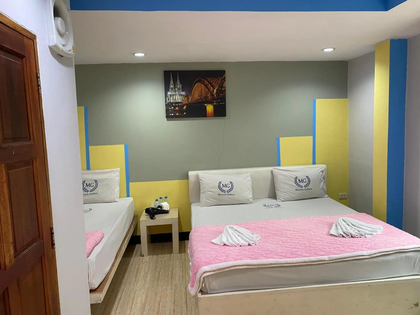 Bed in Miracle Gallery Hotel