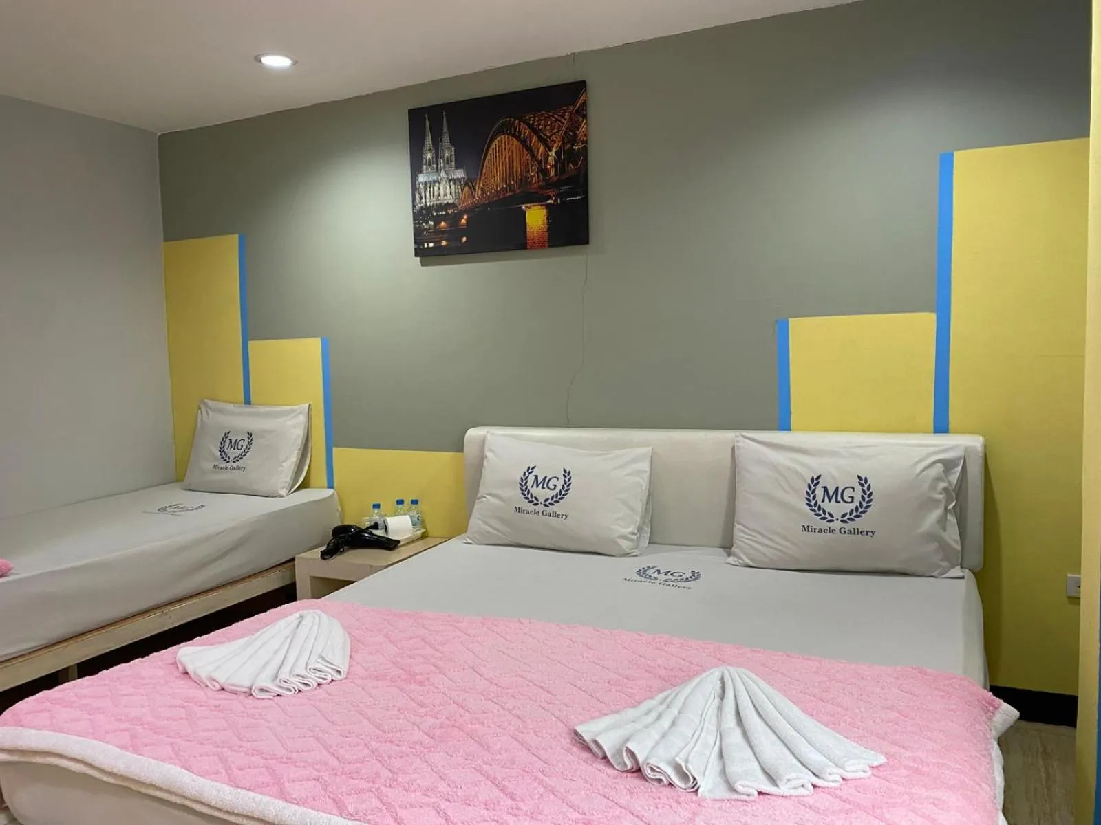 Bed in Miracle Gallery Hotel