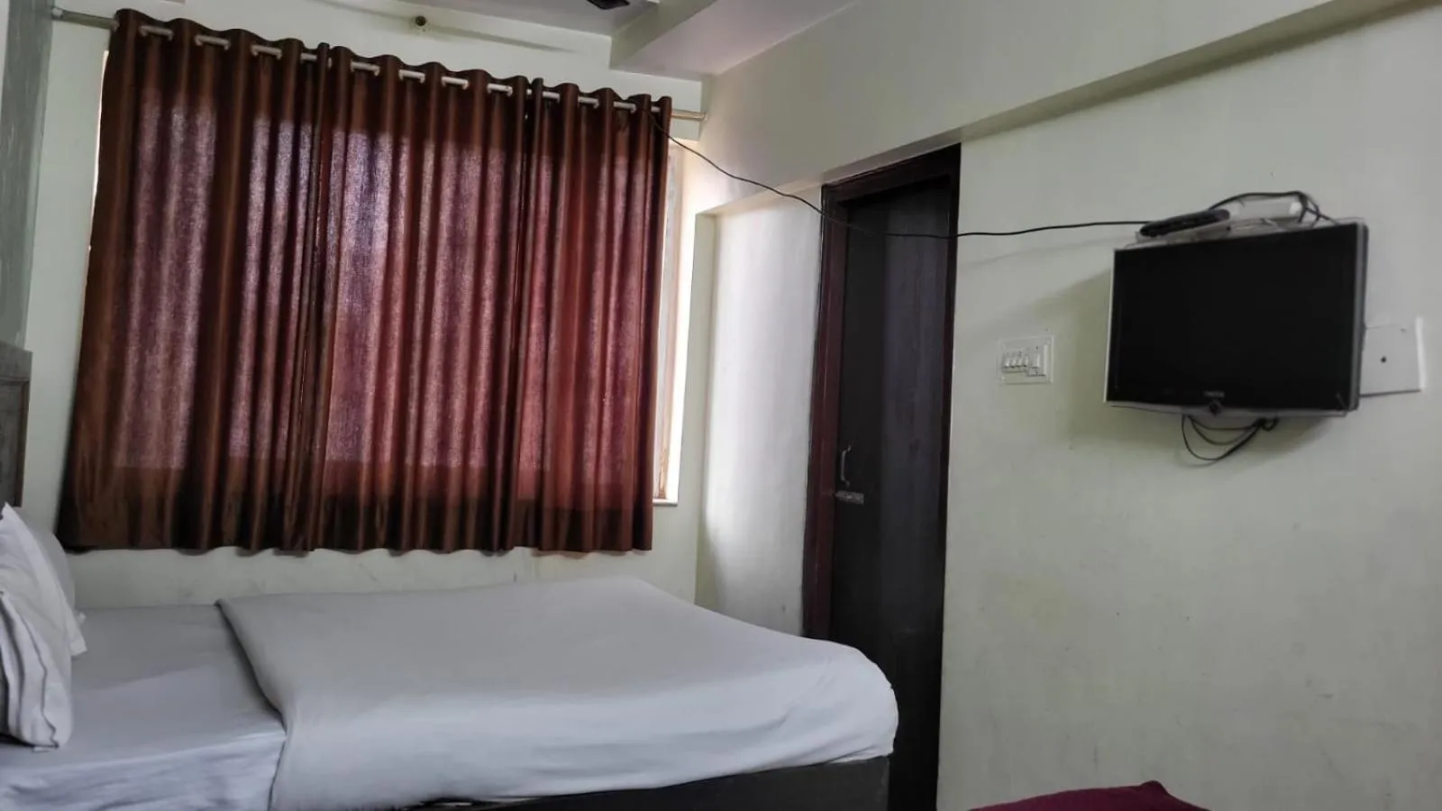Bed in Hotel Atithi Residency