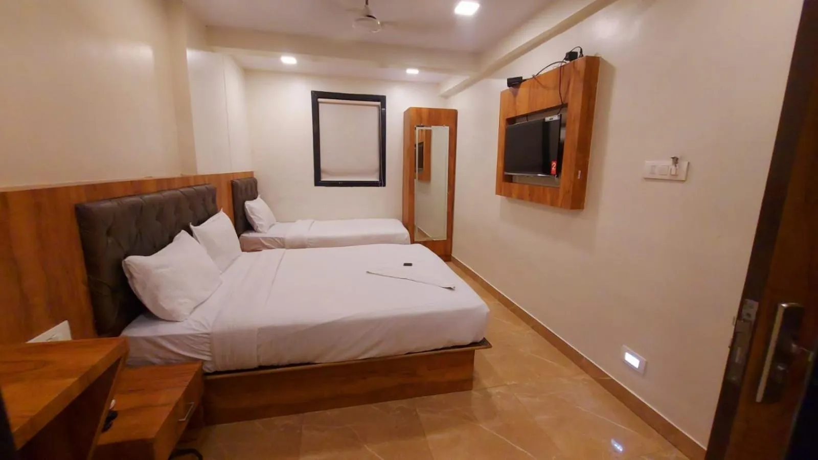 Photo of the whole room, Bed in HOTEL RIGGA INN KOKILABEN DHIRUBHAI AMBANI Hospital