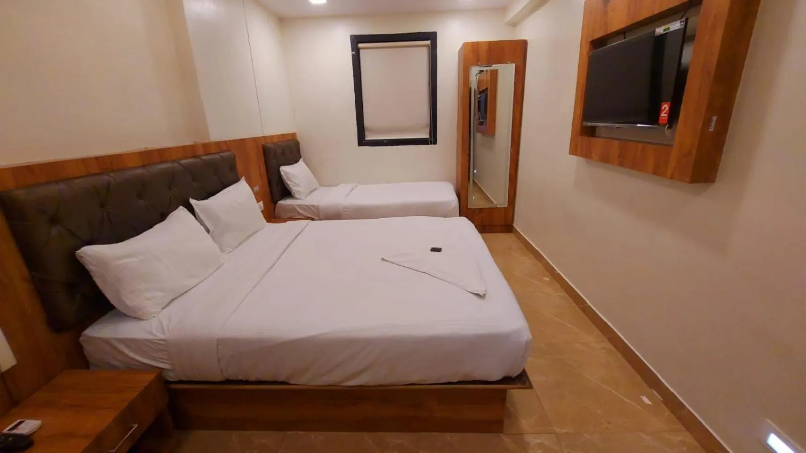 Photo of the whole room, Bed in HOTEL RIGGA INN KOKILABEN DHIRUBHAI AMBANI Hospital