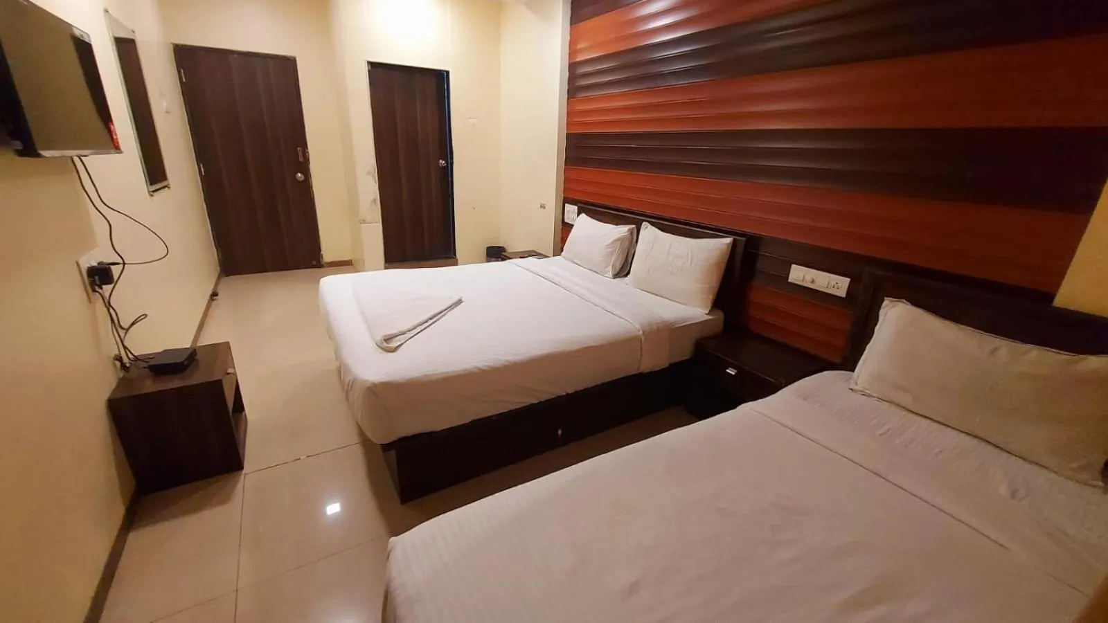 Photo of the whole room, Bed in HOTEL RIGGA INN KOKILABEN DHIRUBHAI AMBANI Hospital