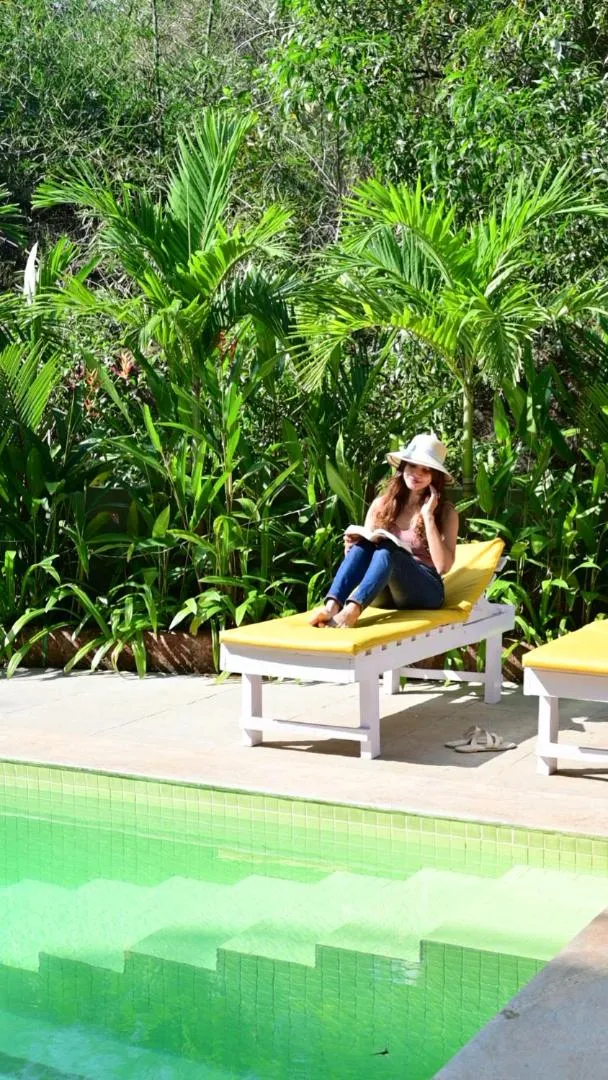 Pool view in Locomo Boutique, Morjim - Cozy tropical stay, near beach