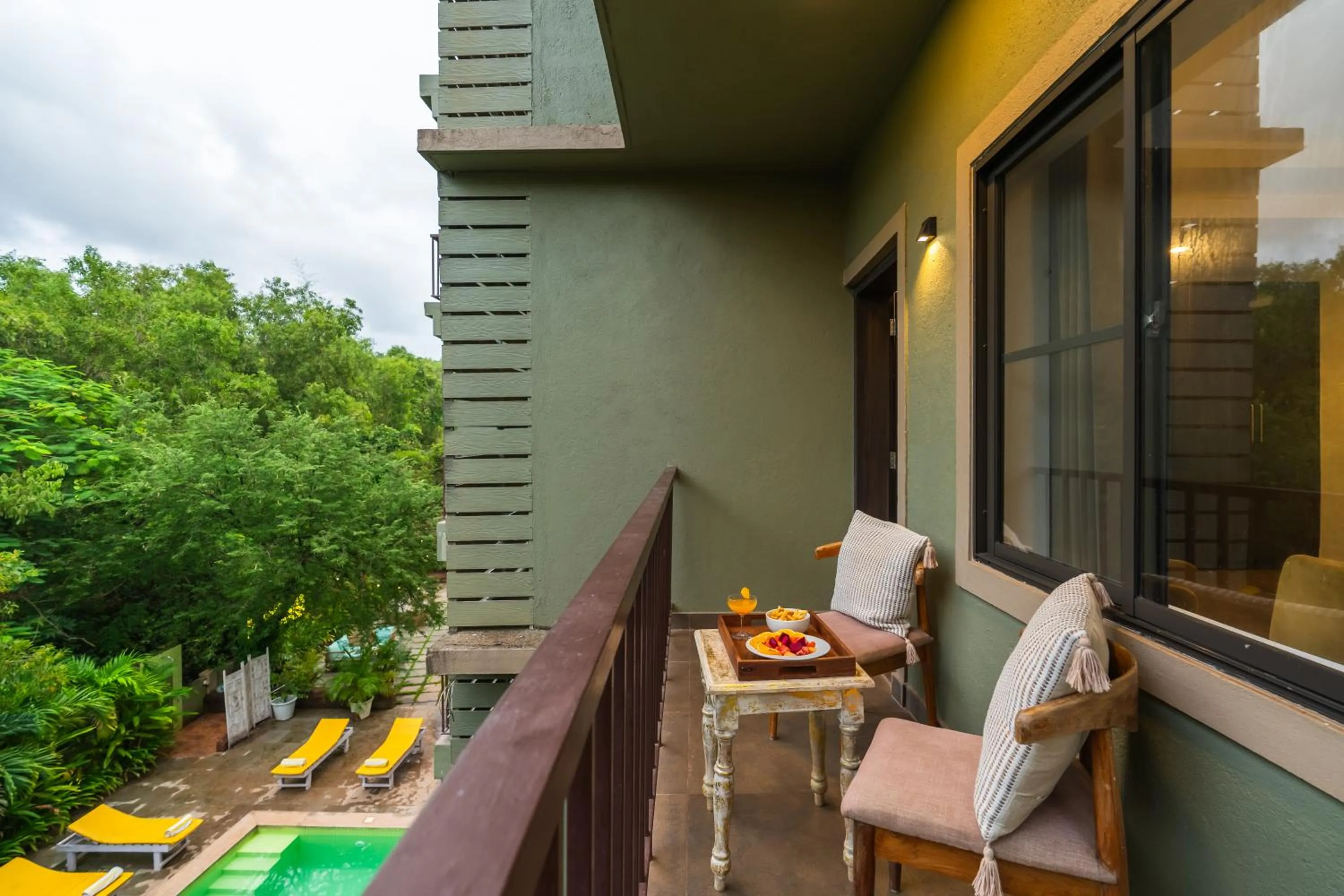Balcony/Terrace in Locomo Boutique, Morjim - Cozy tropical stay, near beach