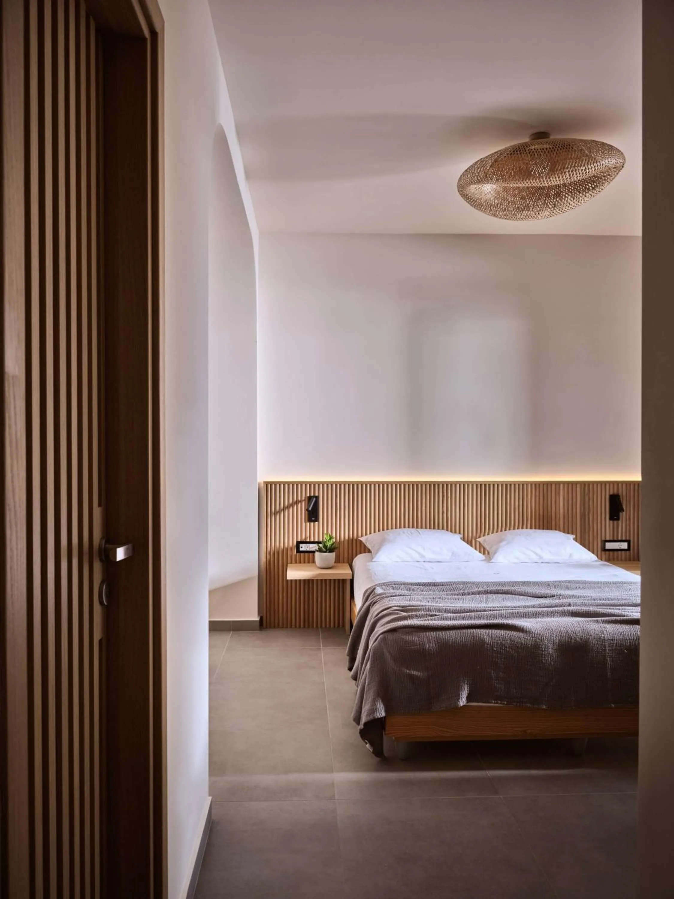 Bed in Elounda Palm Hotel & Suites