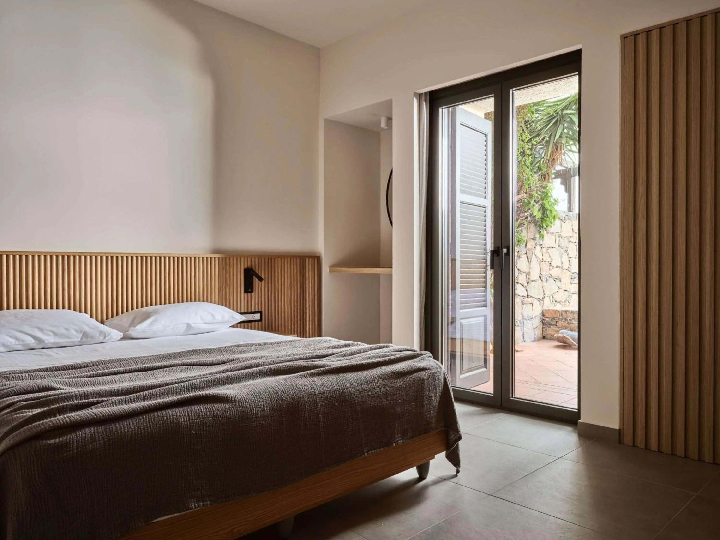 Bed in Elounda Palm Hotel & Suites