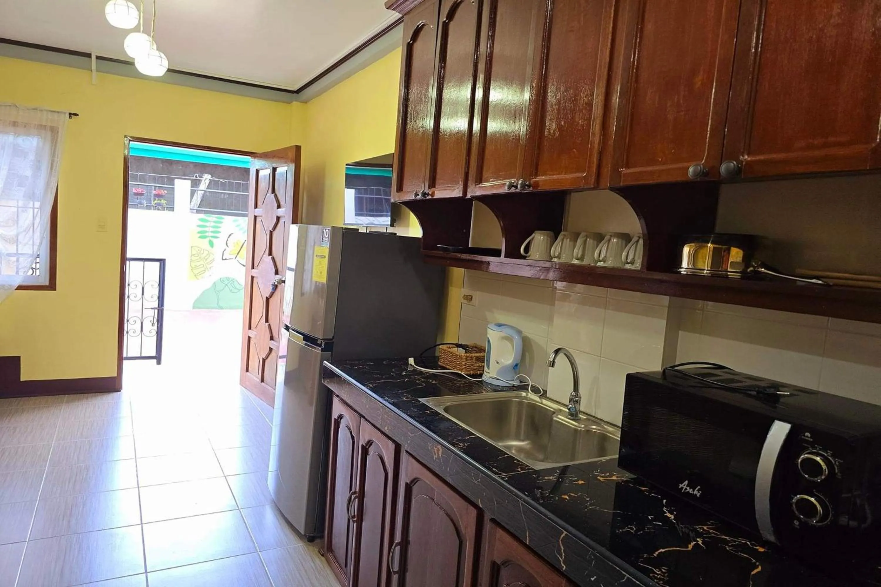 Kitchen or kitchenette in Nober Pension House City Center