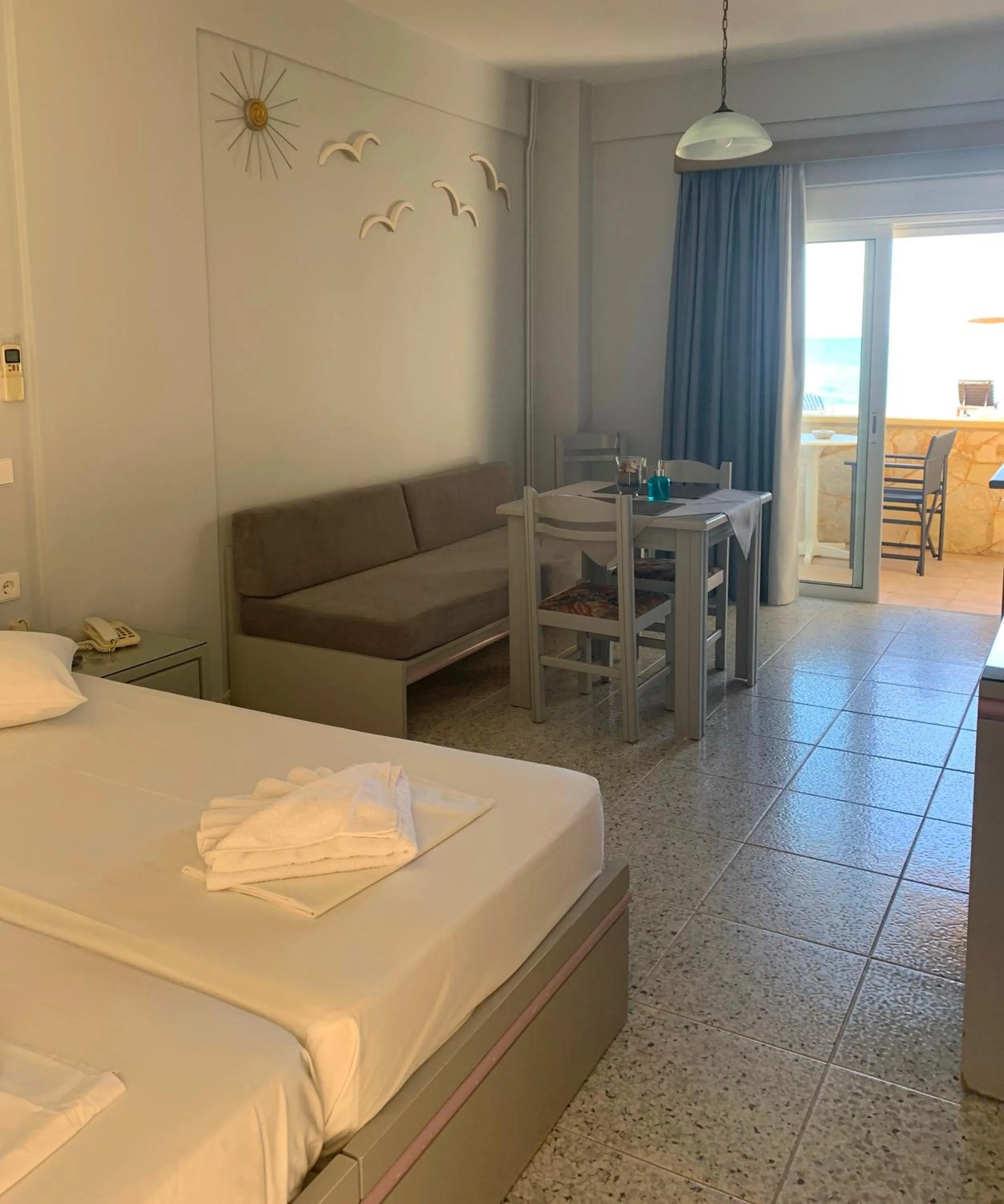 Seating area, Bed in Ermis Suites