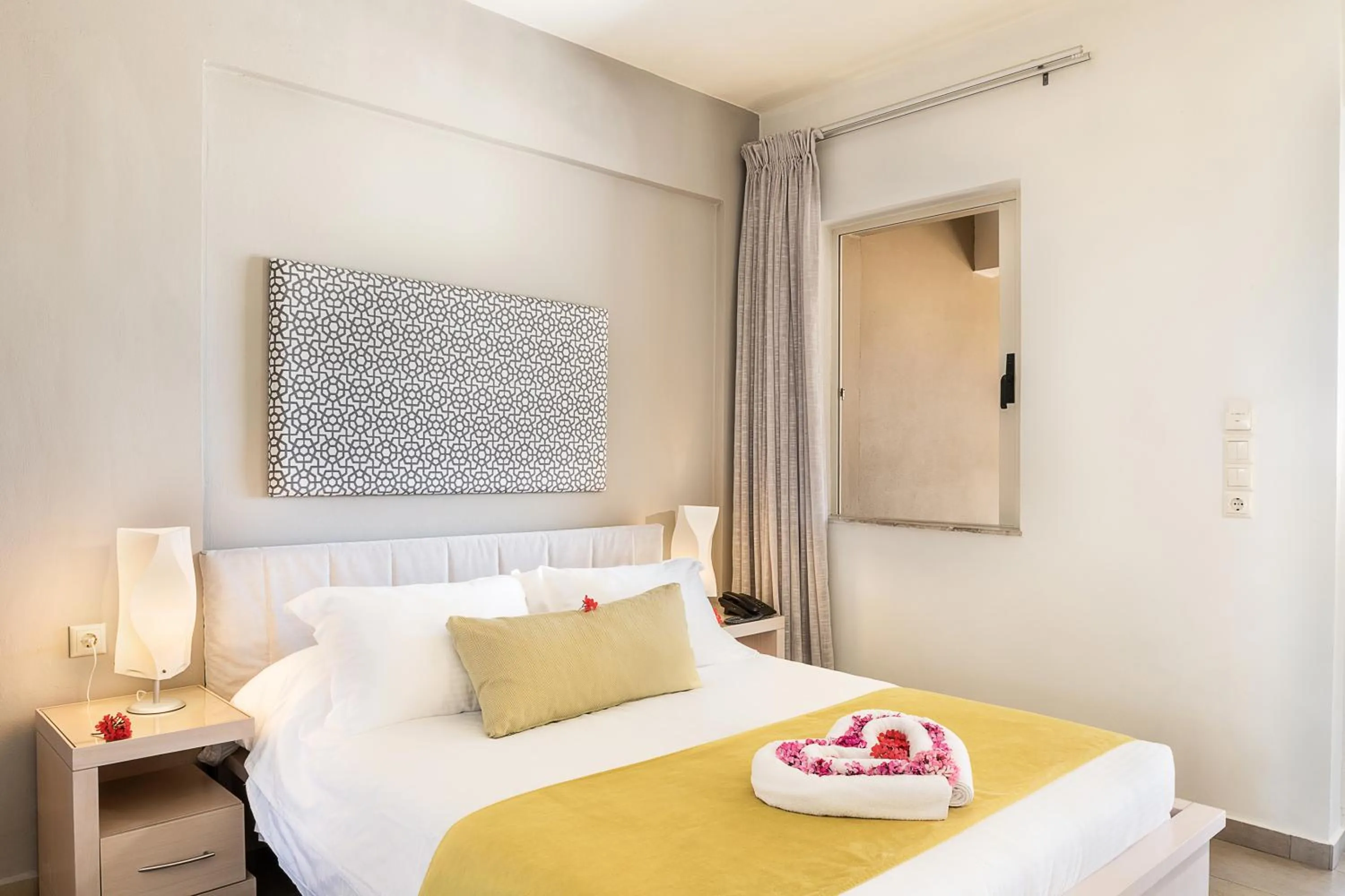 Bed in Kavos Hotel & Suites