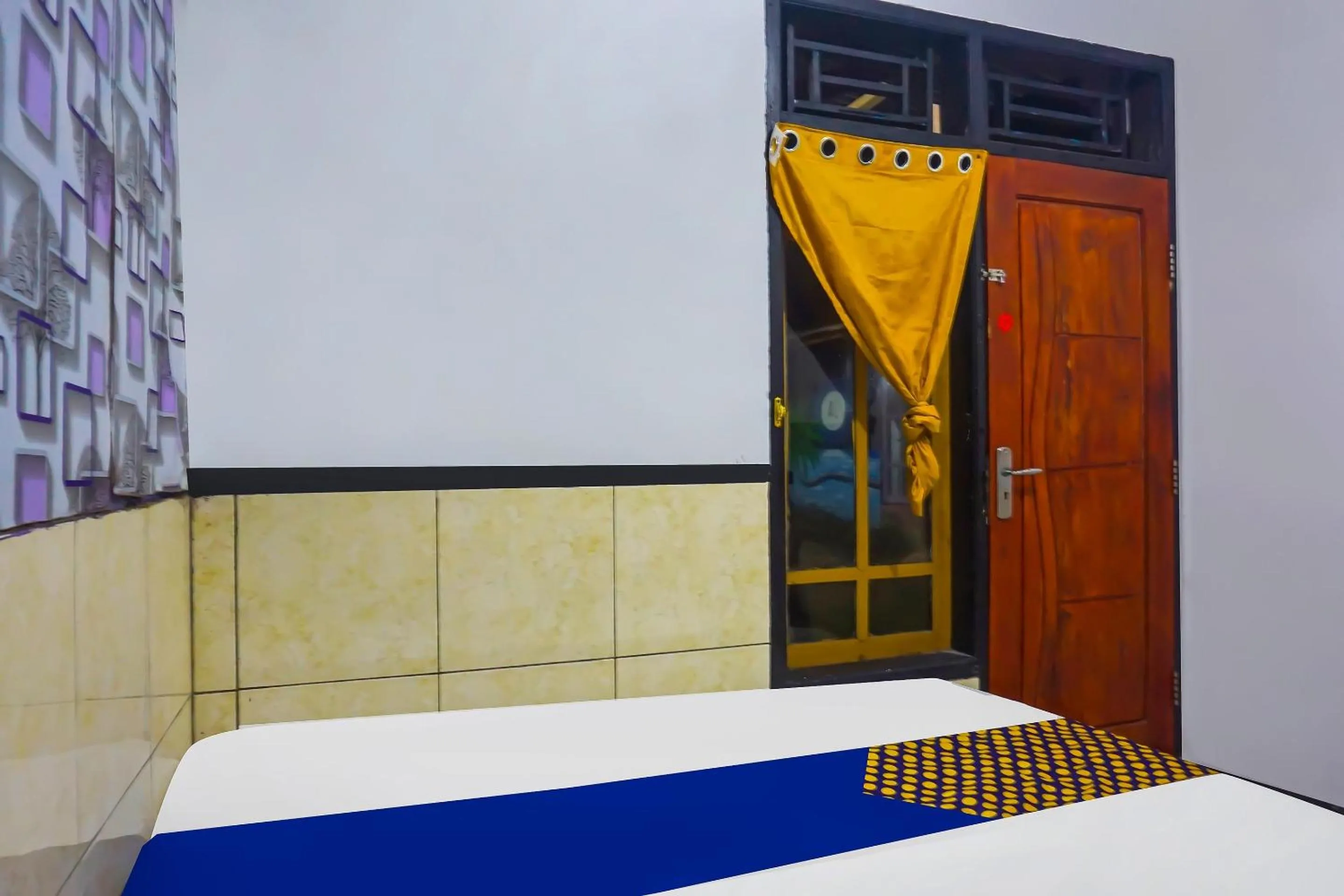 Bedroom in Hotel O Nusasari Guest House