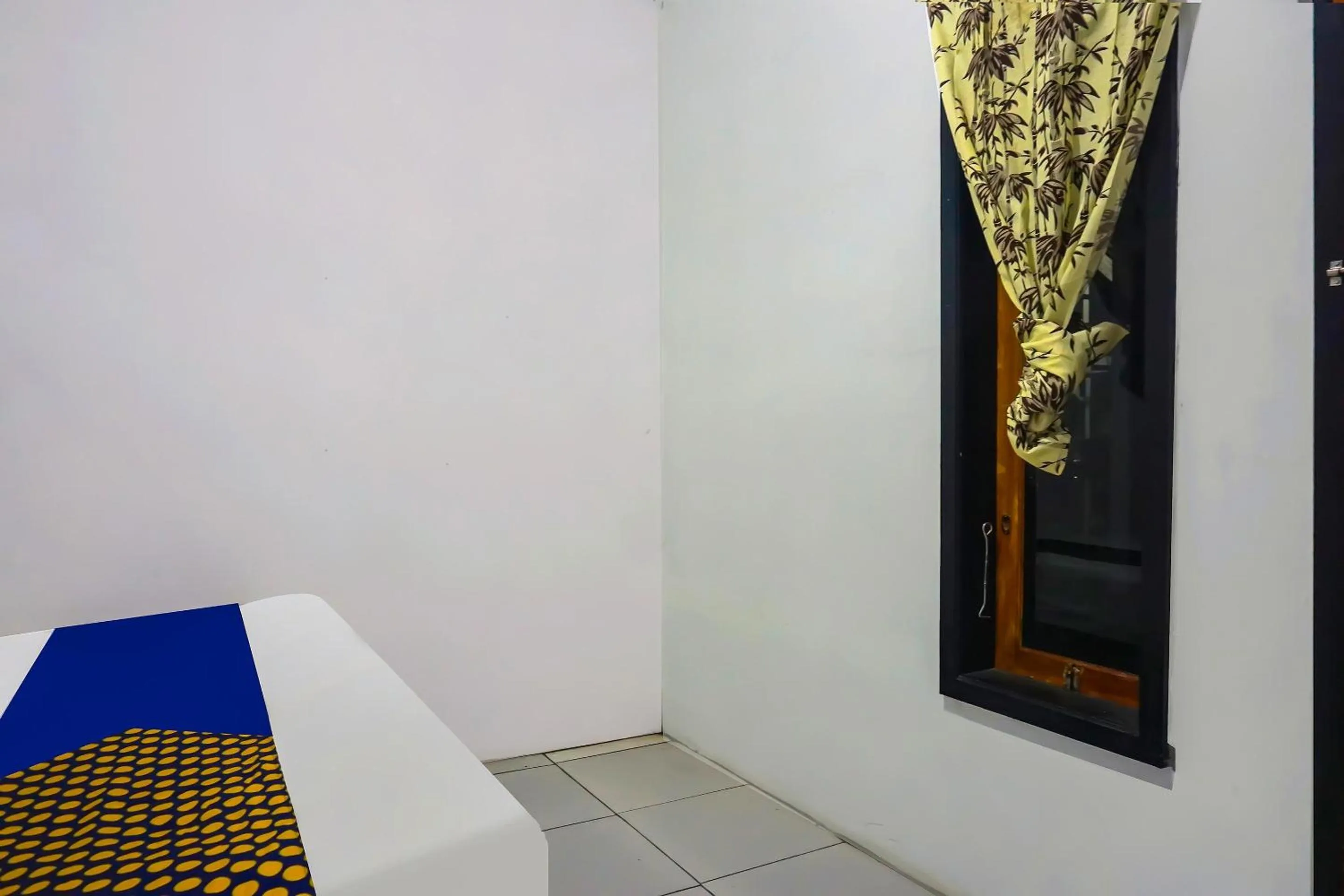 Bedroom in Hotel O Nusasari Guest House