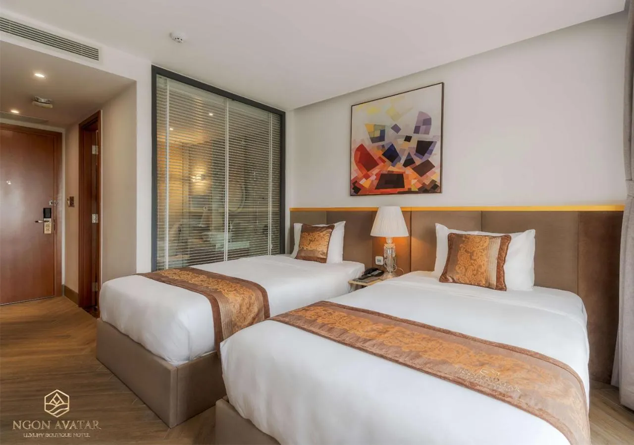 Bed in Ngon Avatar Hotel