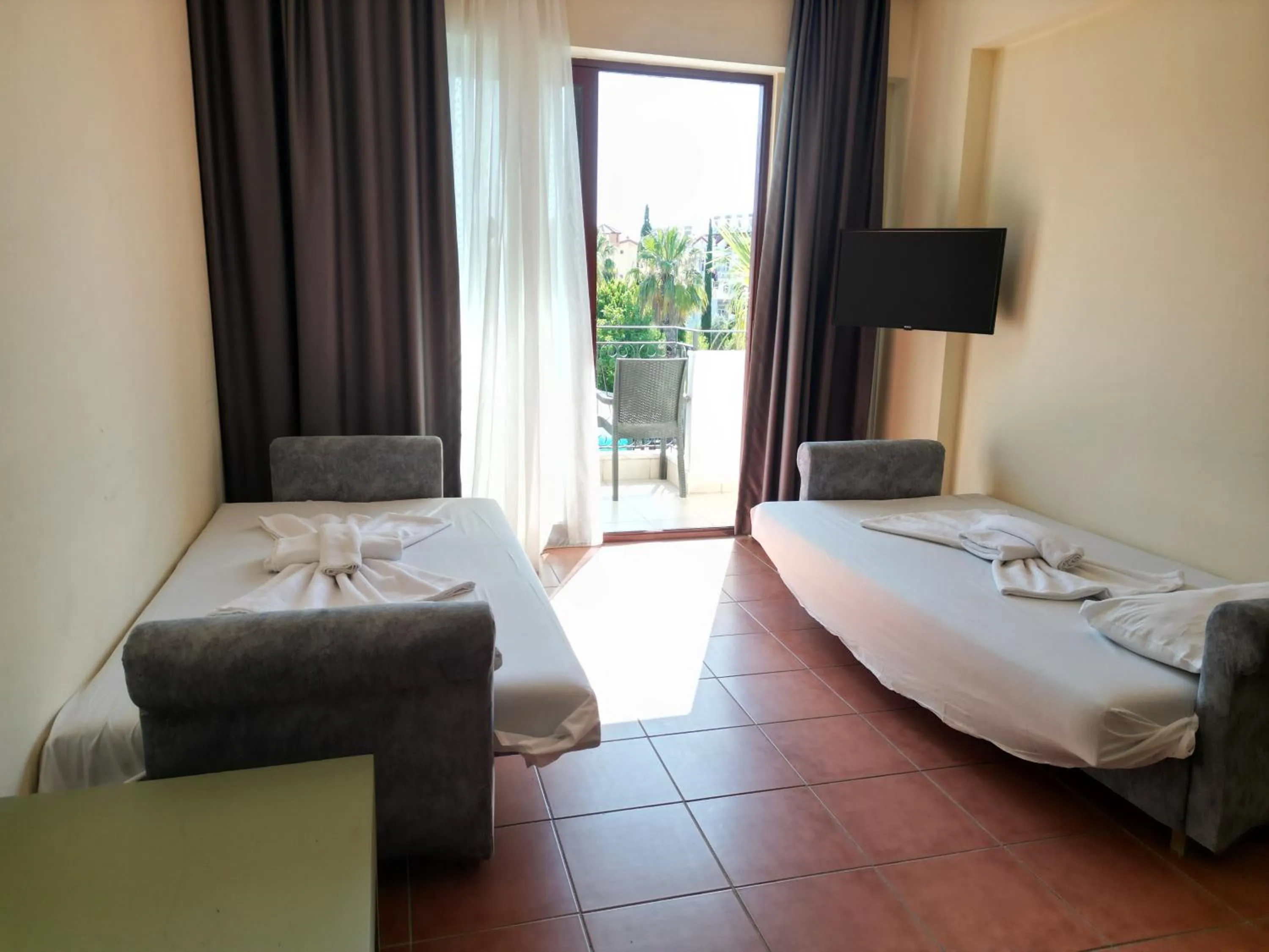 TV and multimedia, Bed in LEMAS SUITE HOTEL