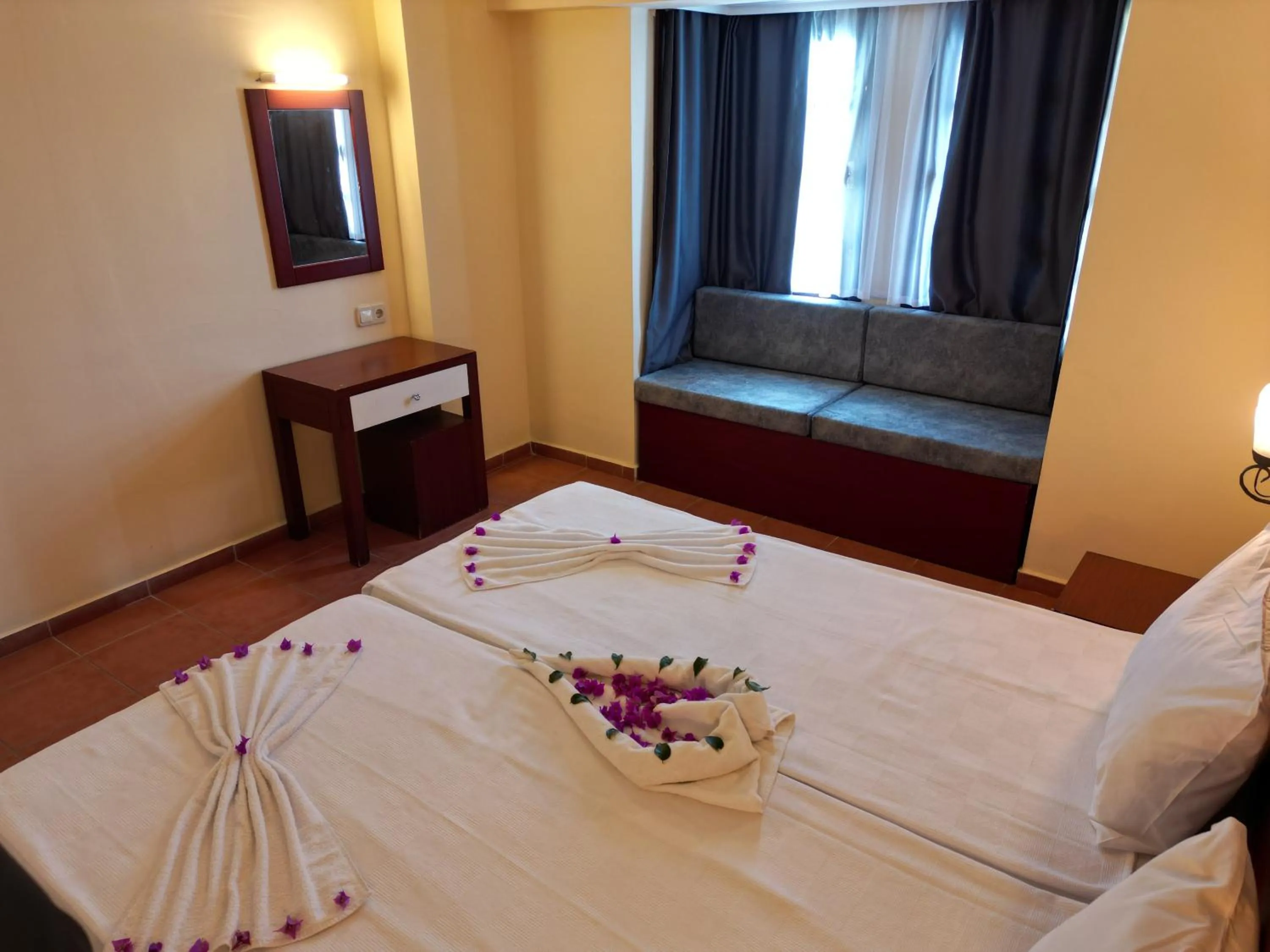 Bed in LEMAS SUITE HOTEL