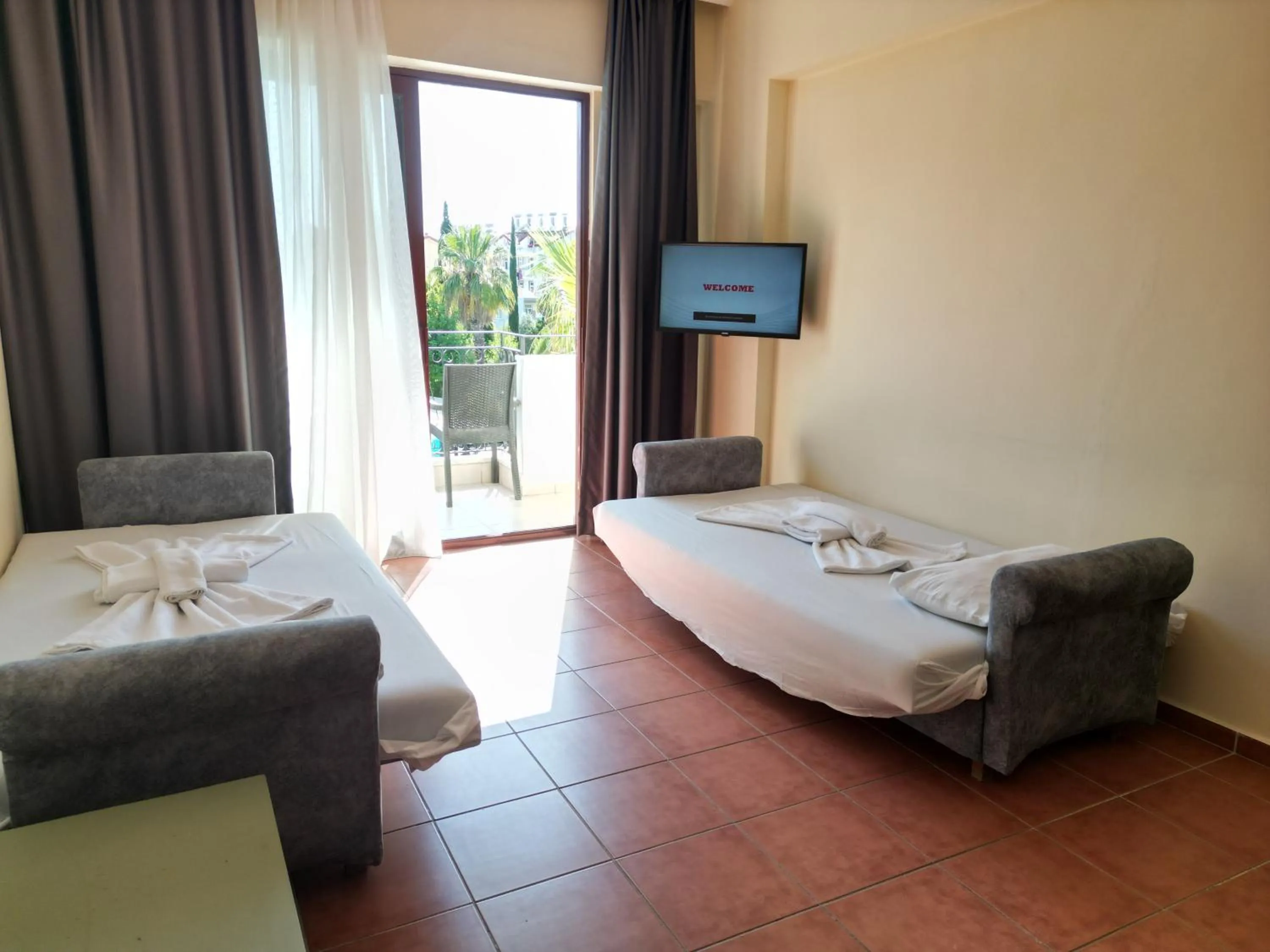 TV and multimedia, Bed in LEMAS SUITE HOTEL