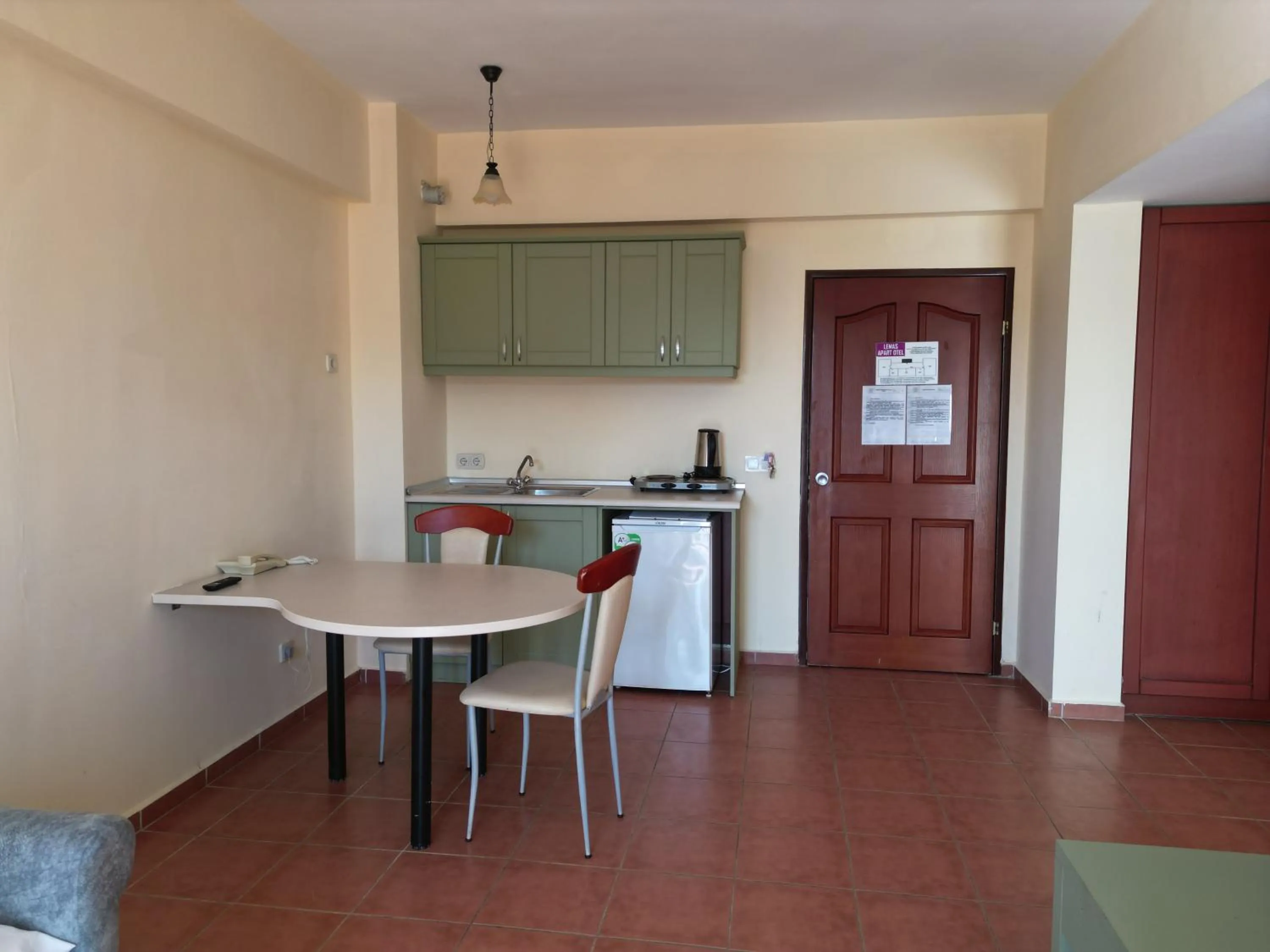 Kitchen or kitchenette in LEMAS SUITE HOTEL