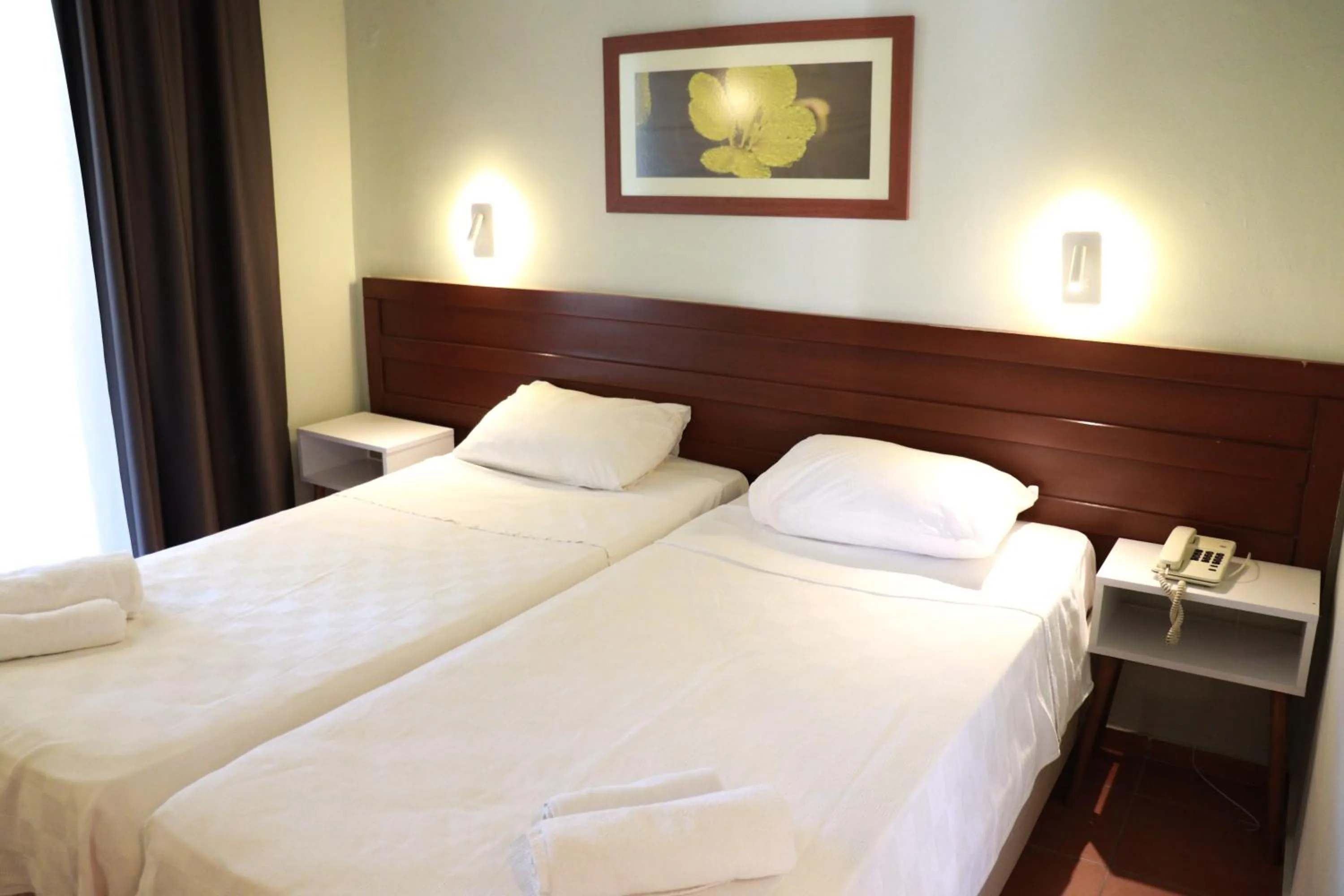 Bed in LEMAS SUITE HOTEL