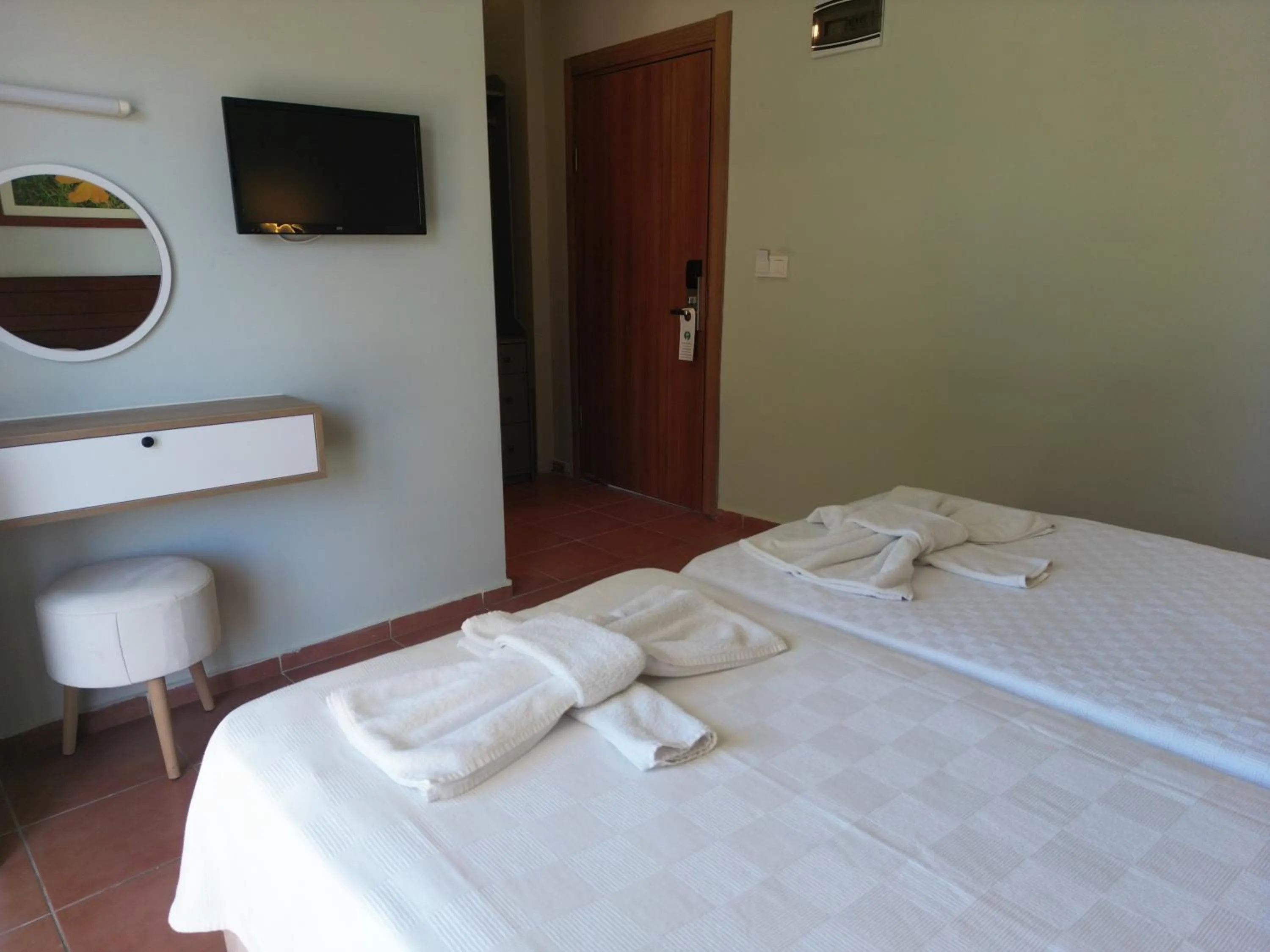 Bed in LEMAS SUITE HOTEL