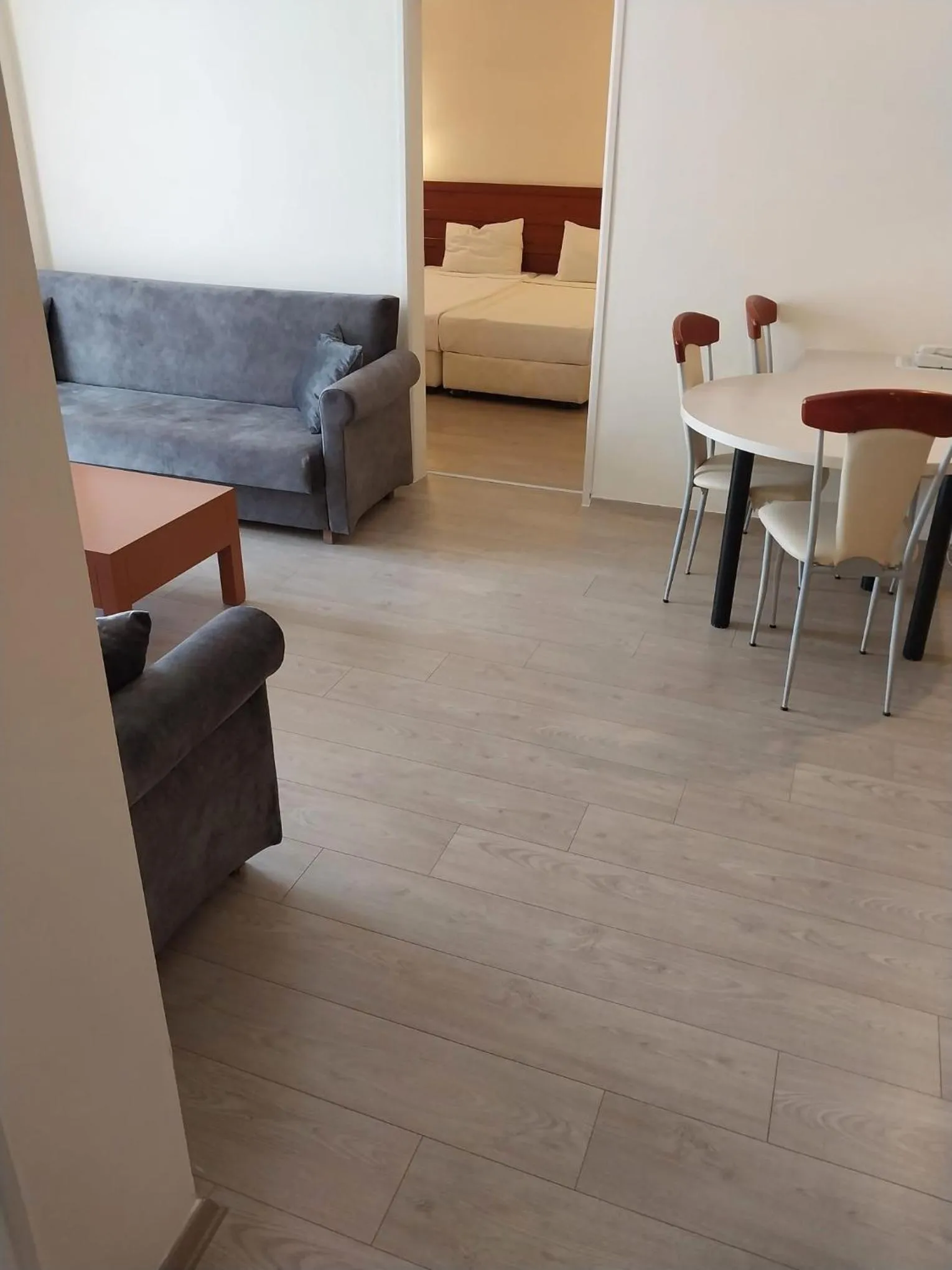 Bed in LEMAS SUITE HOTEL