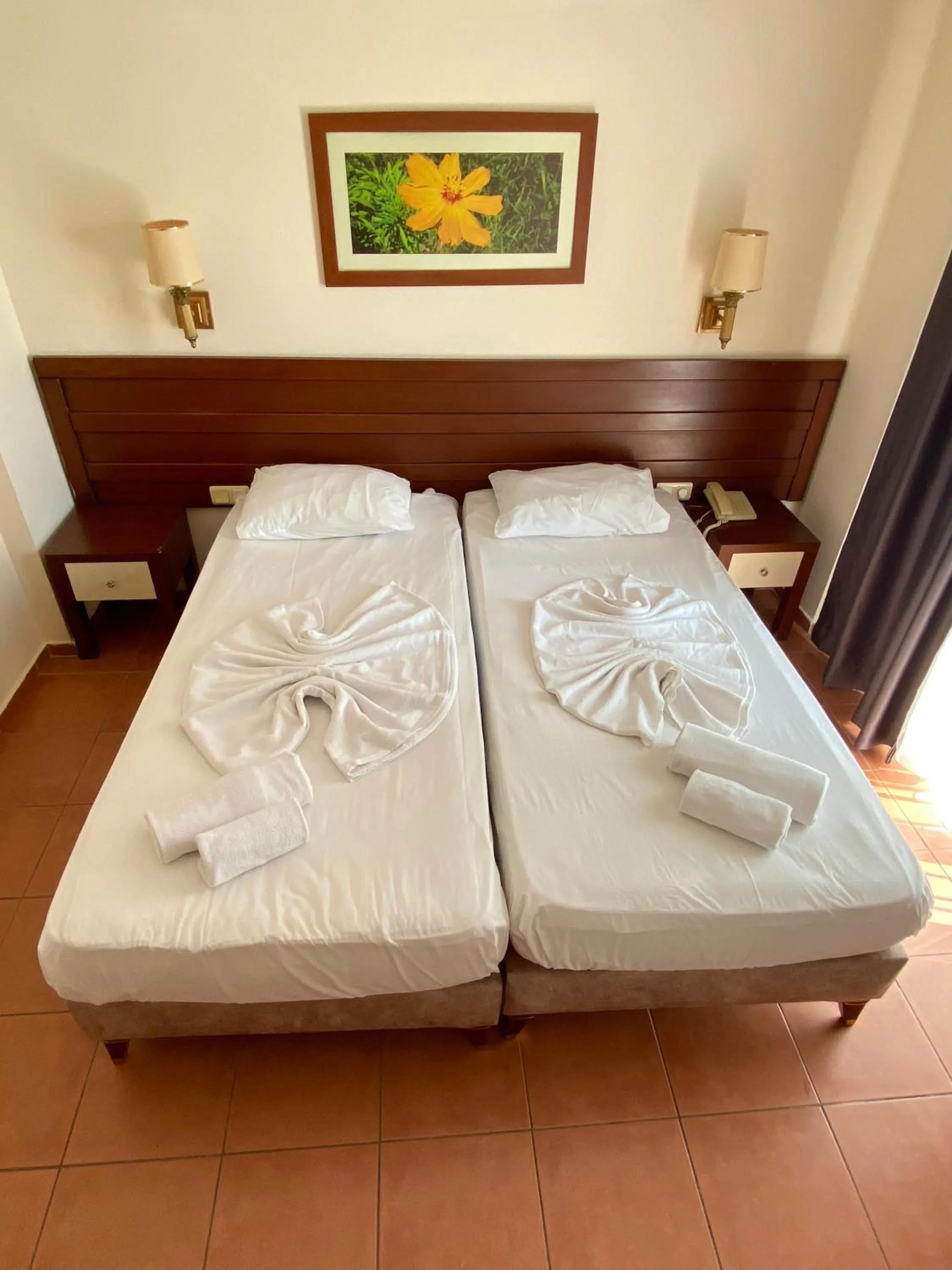 Bed in LEMAS SUITE HOTEL