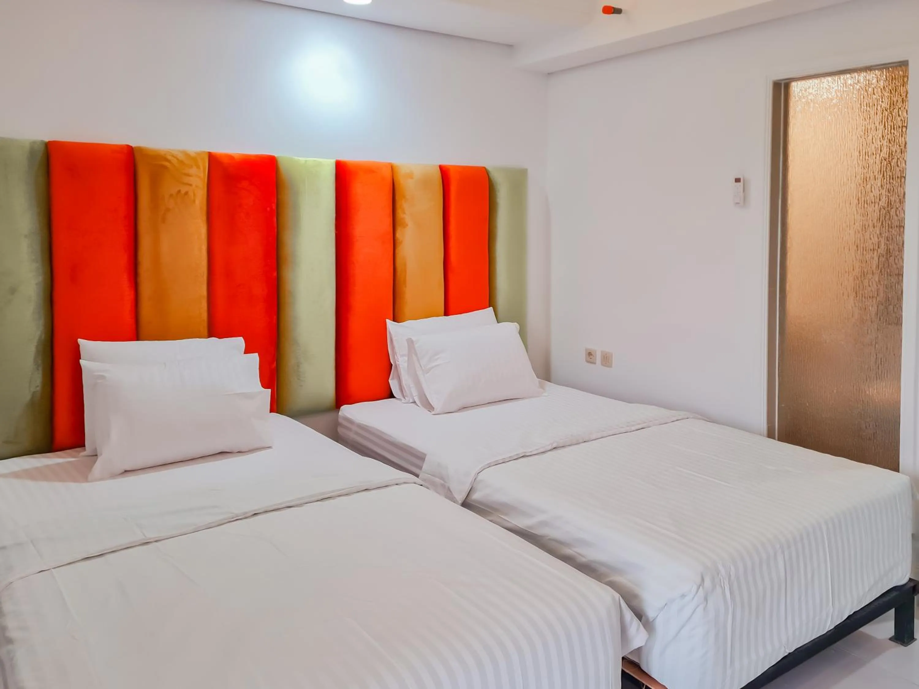 Bedroom, Bed in Sans Hotel Grand Sabaraya Cikampek