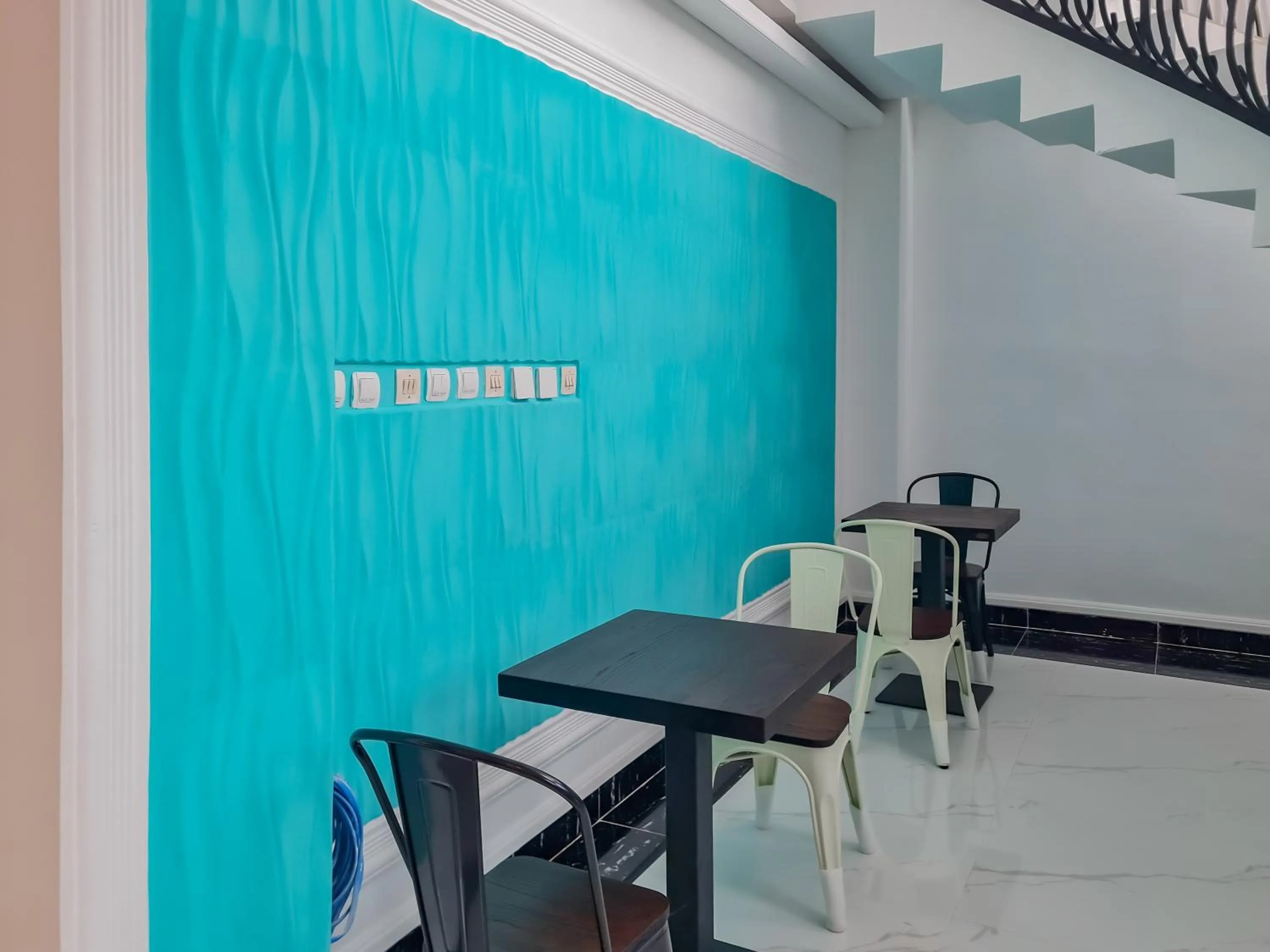 Seating area in Sans Hotel Grand Sabaraya Cikampek