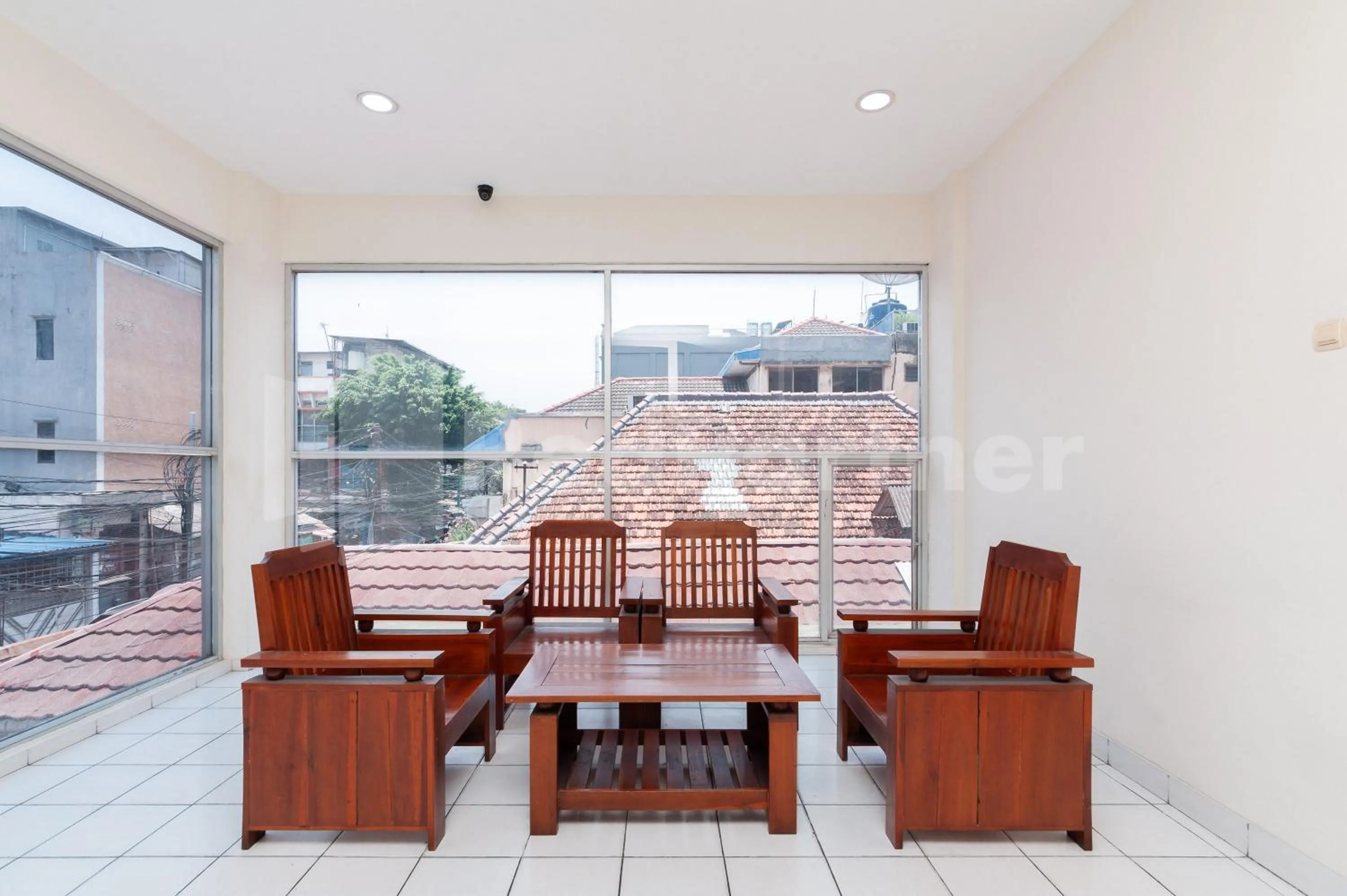 Living room in Orange Garden 47 Mitra RedDoorz