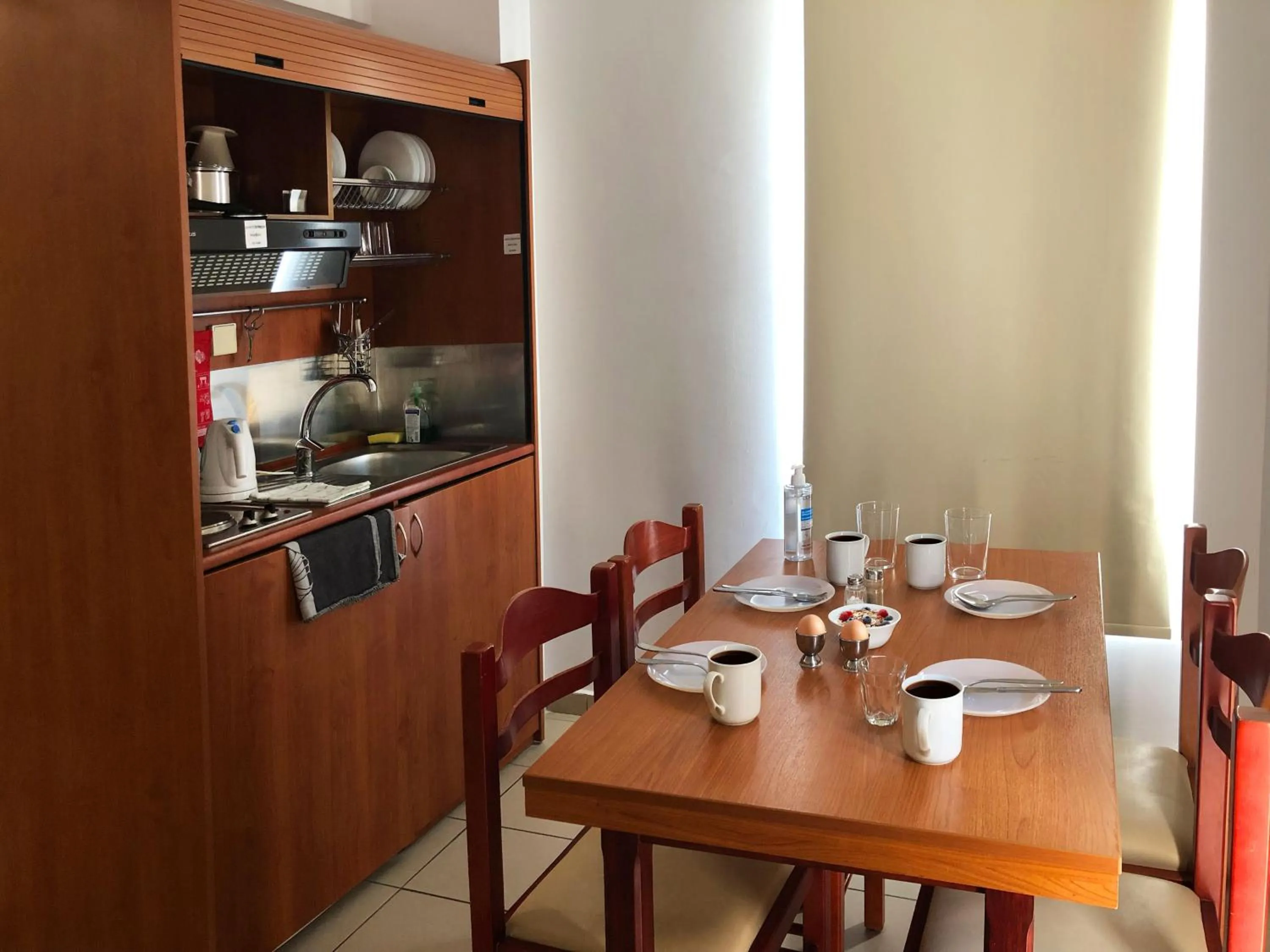 Kitchen or kitchenette in Caravel Hotel Apartments