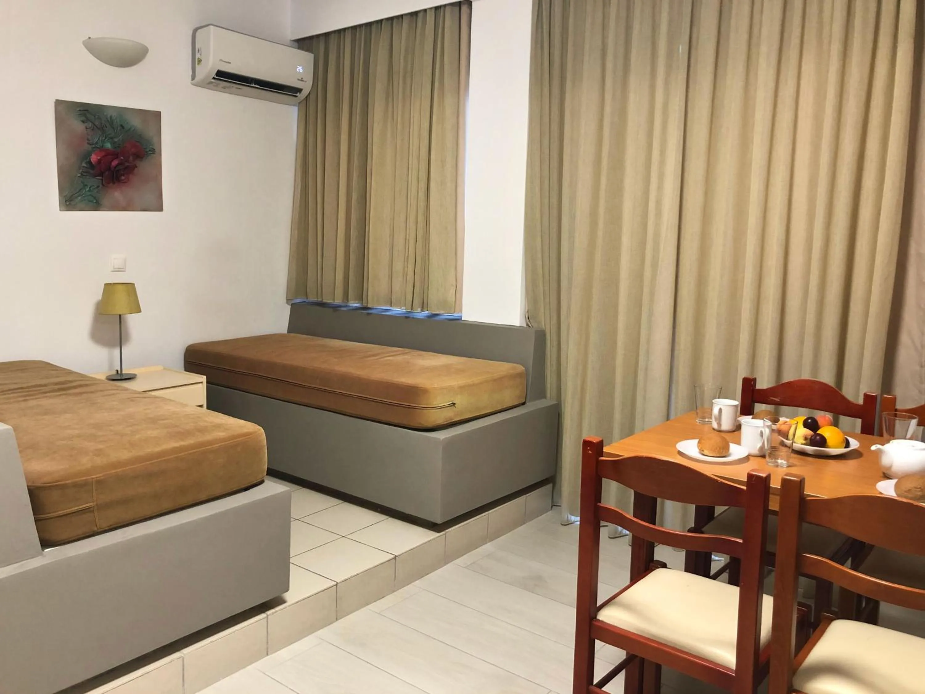 Bed in Caravel Hotel Apartments
