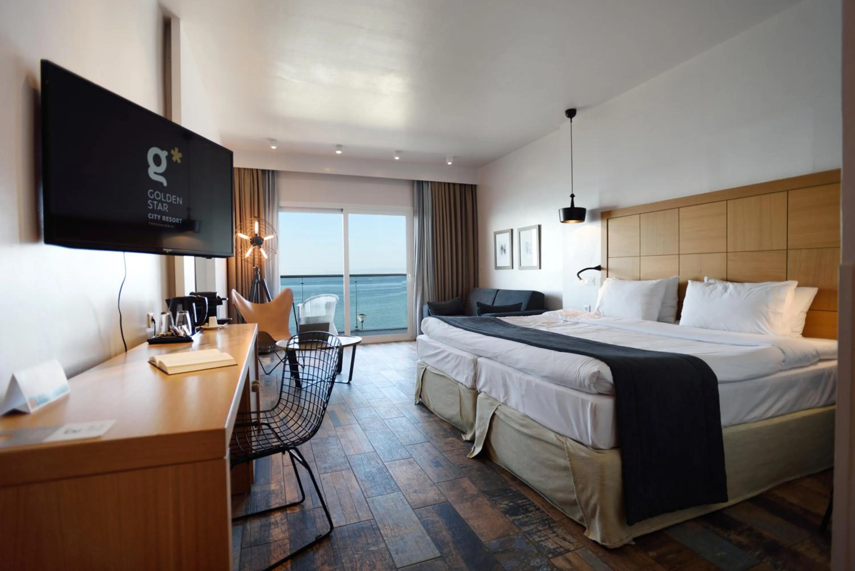 Communal lounge/ TV room, Bed in Golden Star City Resort