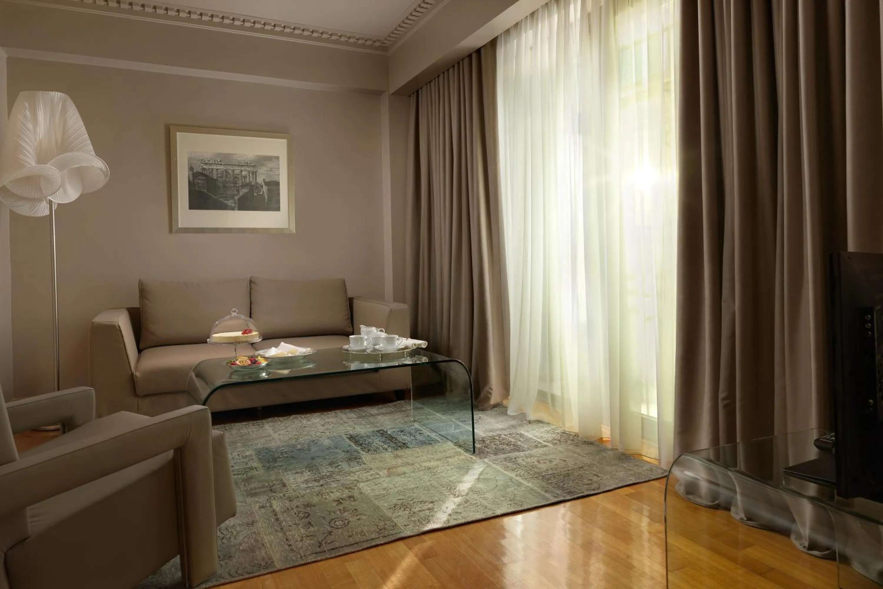Living room, Bed in NJV Athens Plaza