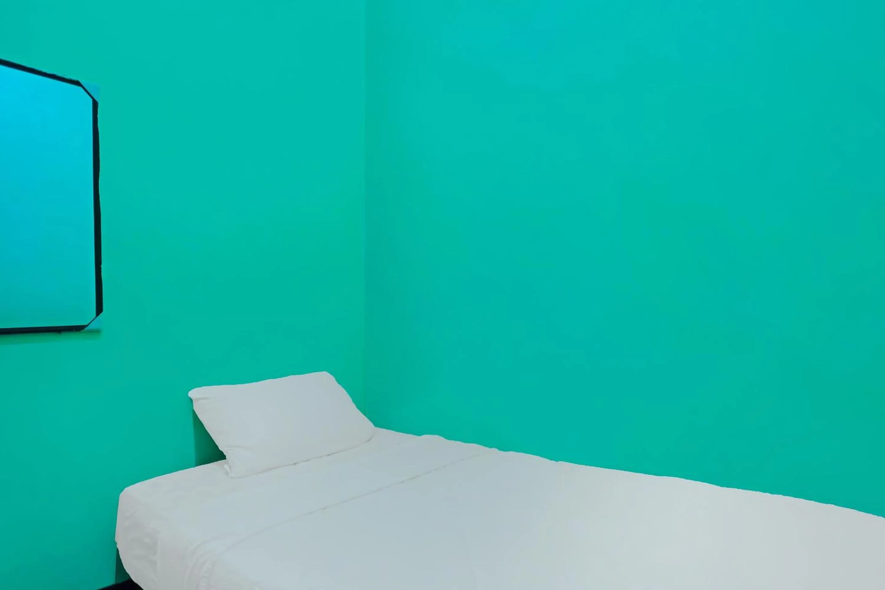 Bedroom in Hotel O Penginapan LorraNearPasar Oleh Oleh