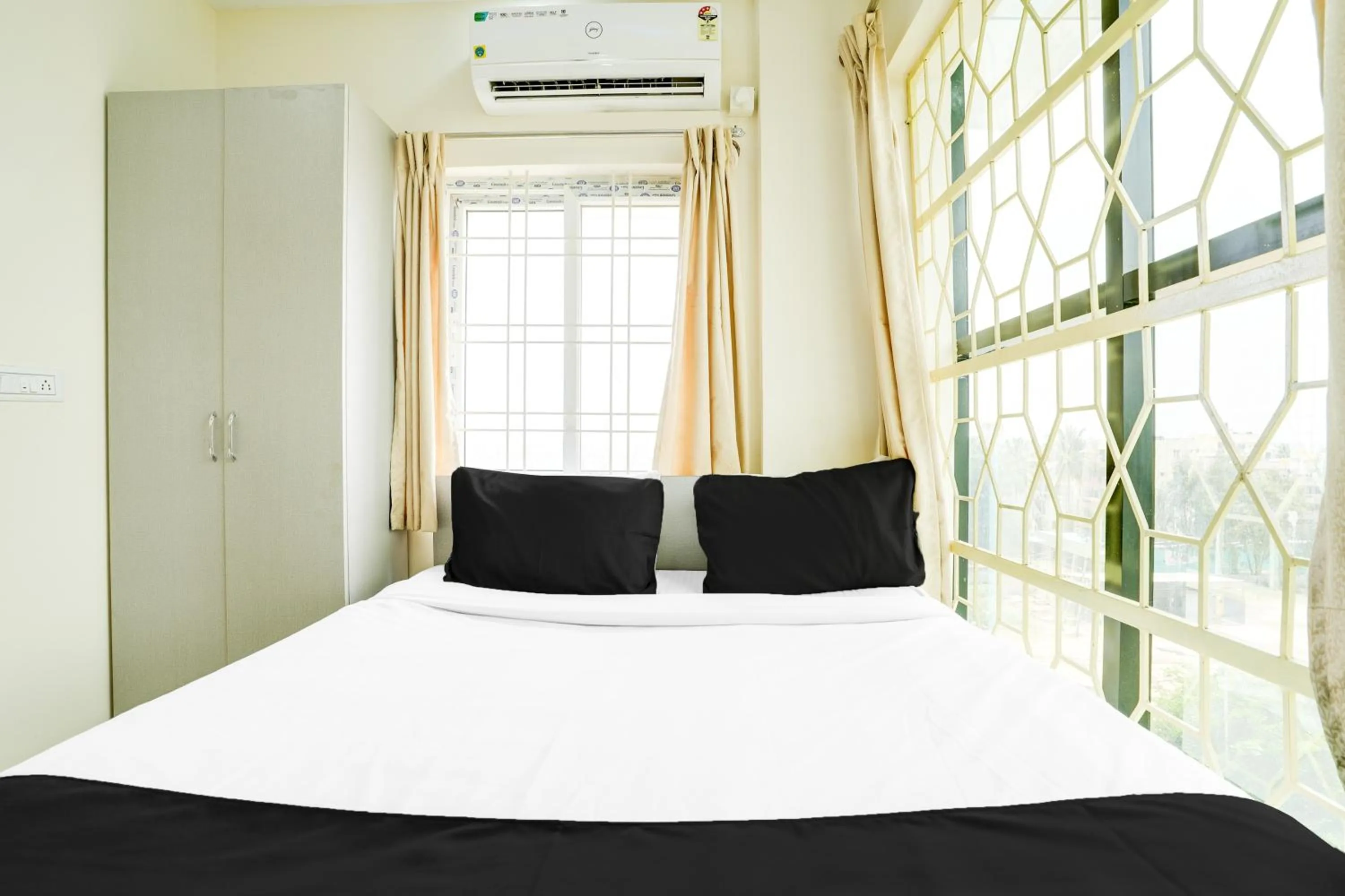 Bedroom, Bed in Super Hotel O Bangalore Near Reva Circle Formerly CKA Boarding