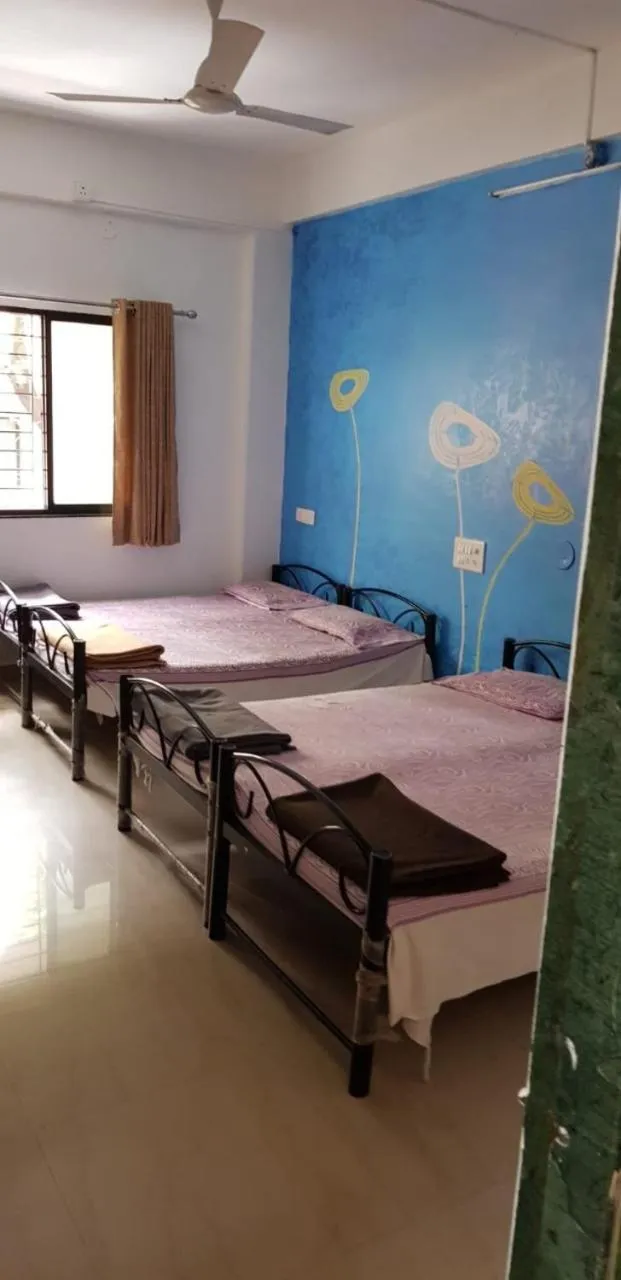 Bed in Om Shree Yatri Niwas