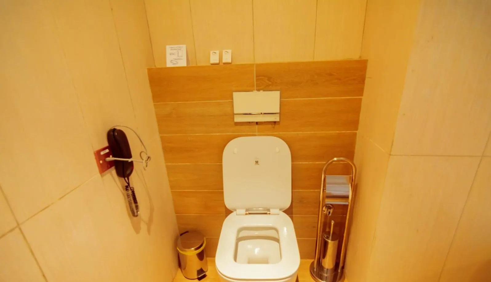 Toilet in Trois Ore Residences & Green Earth Bistro
