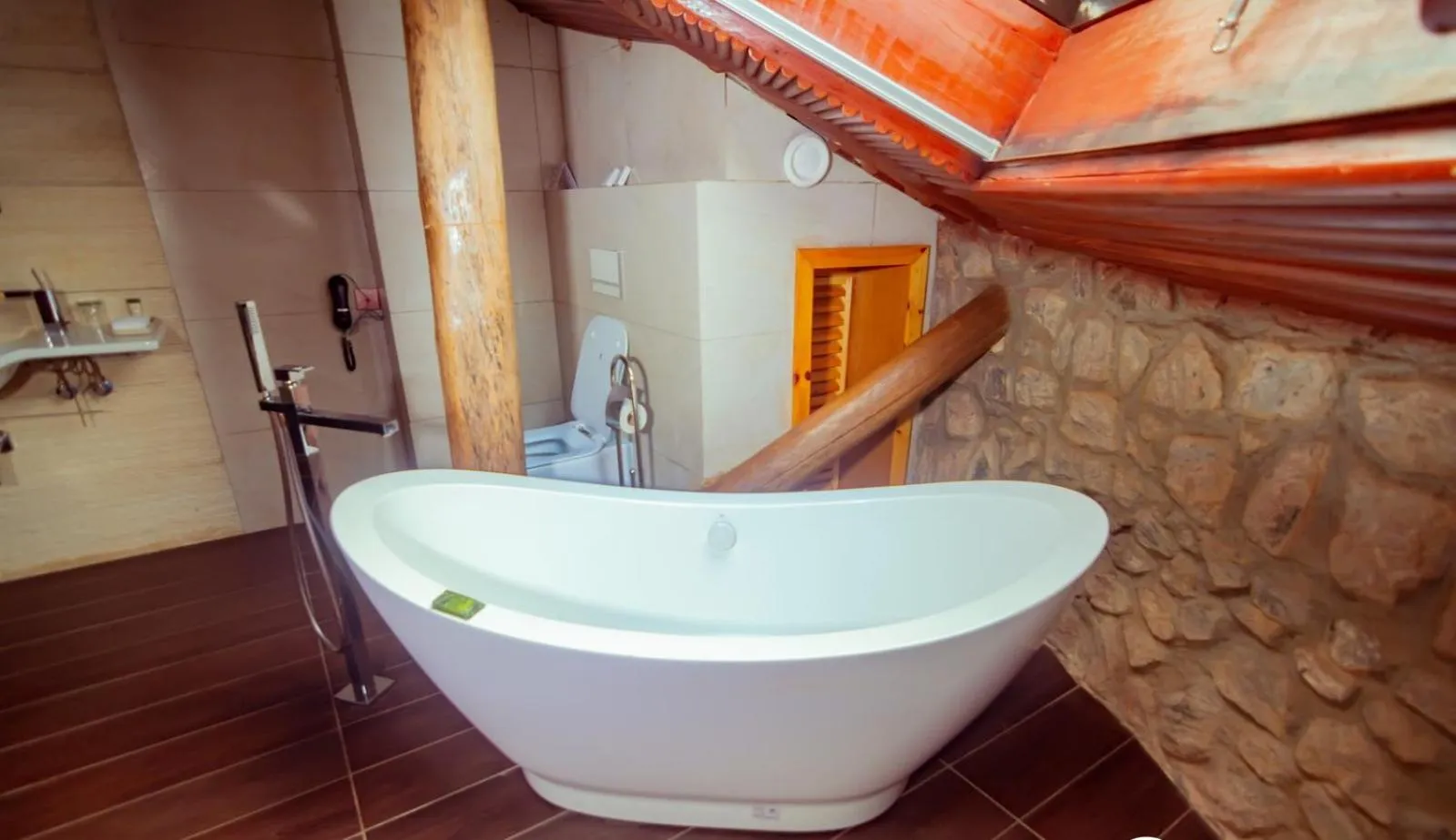 Toilet in Trois Ore Residences & Green Earth Bistro