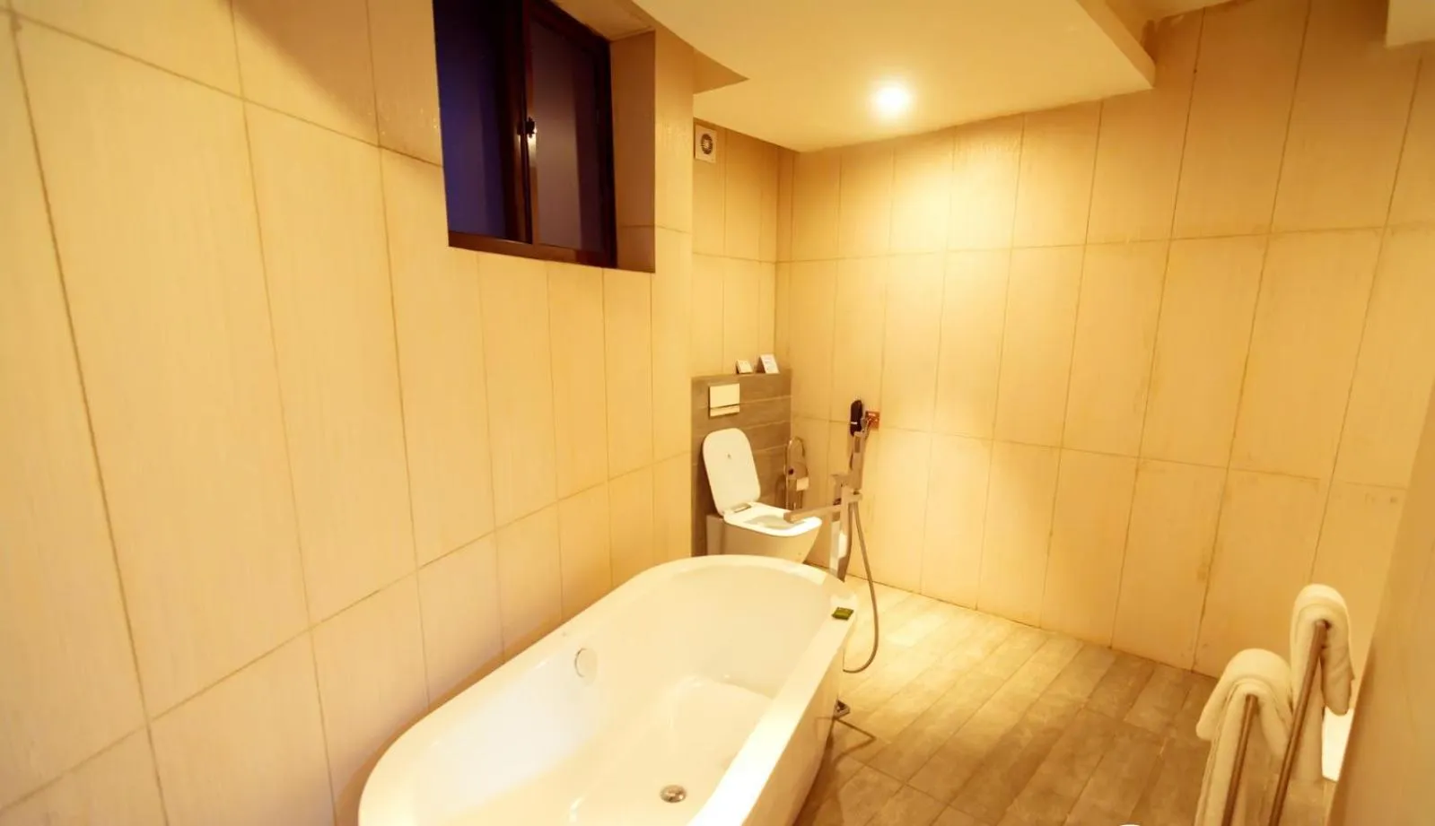 Toilet in Trois Ore Residences & Green Earth Bistro
