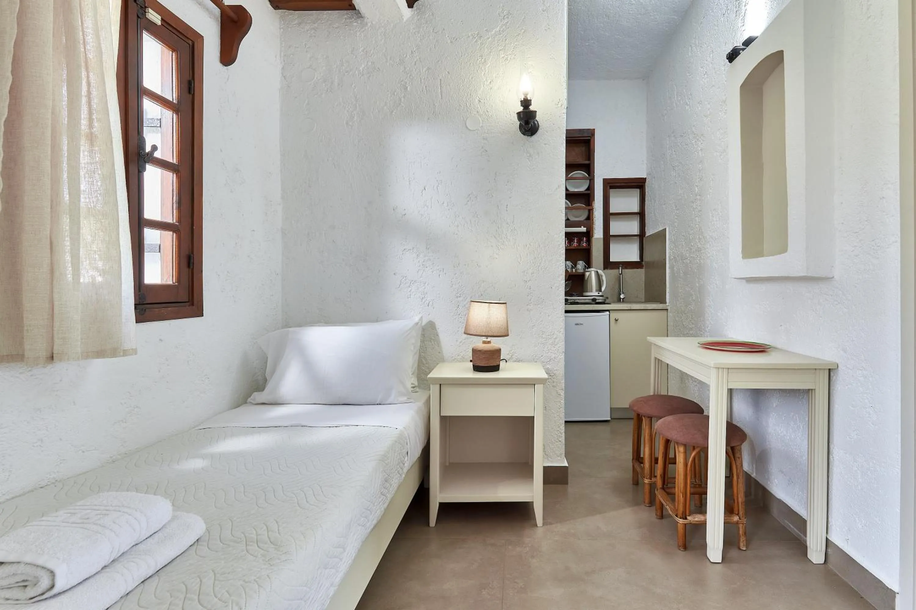 Bed in Mila Malia Studios Hotel