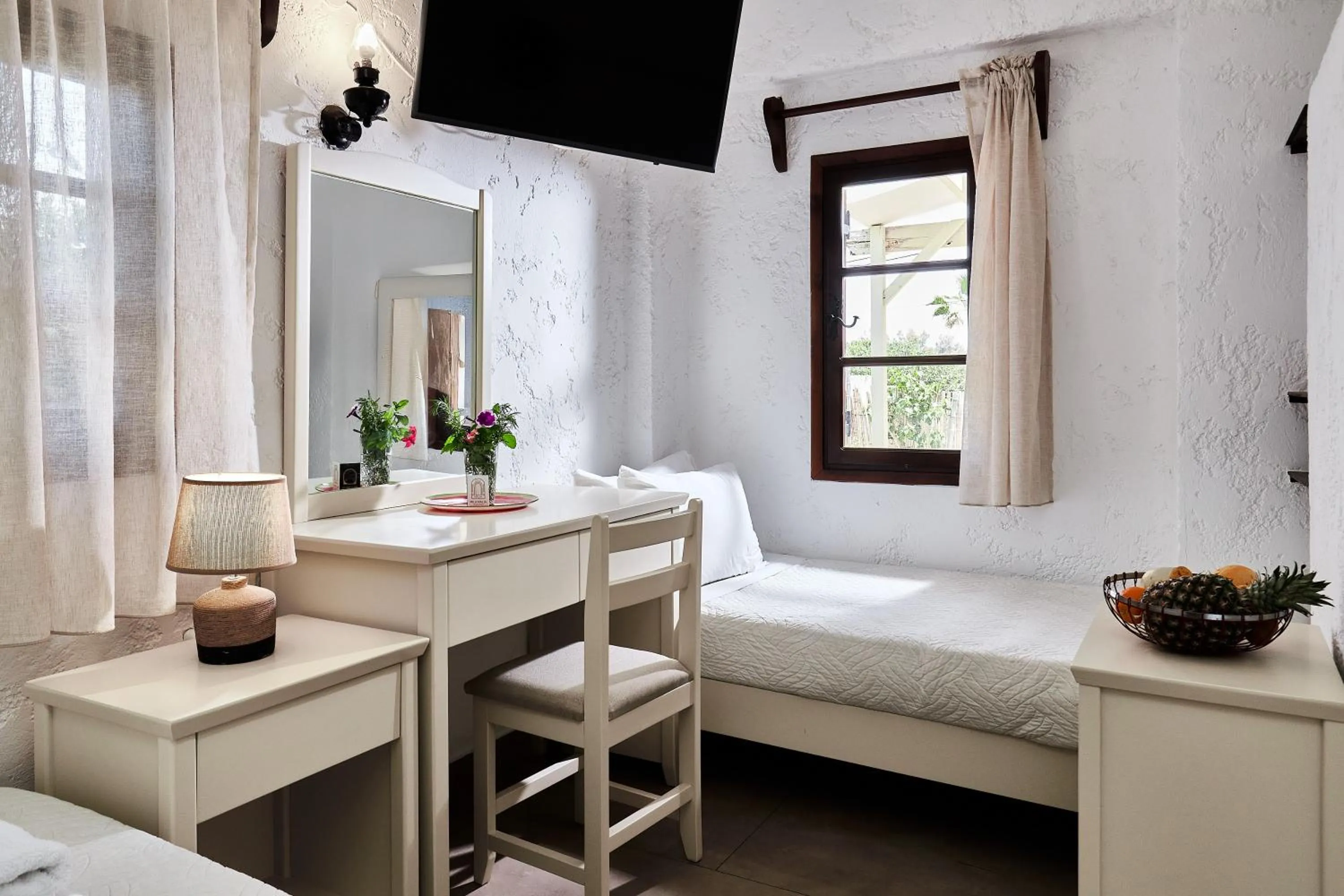 Bed in Mila Malia Studios Hotel