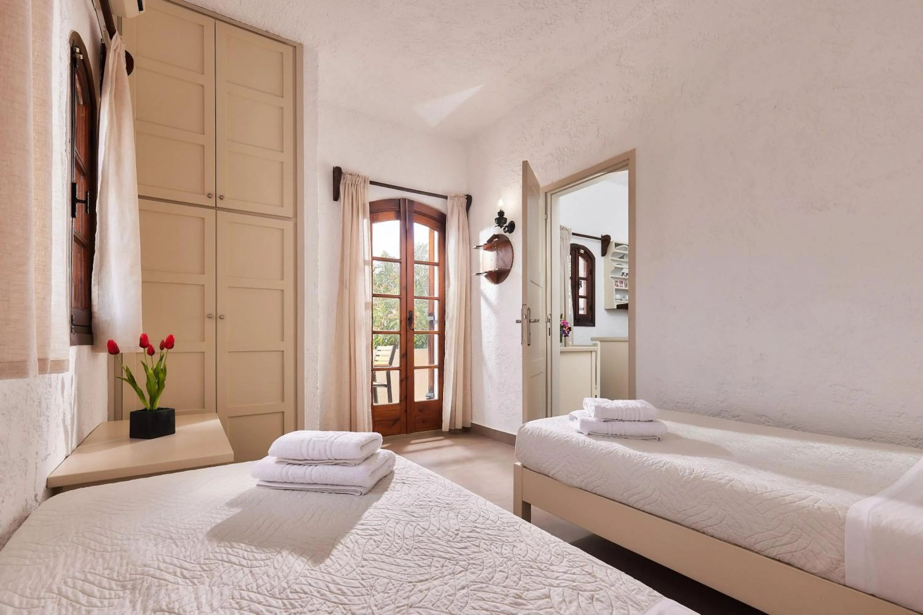 Bed in Mila Malia Studios Hotel