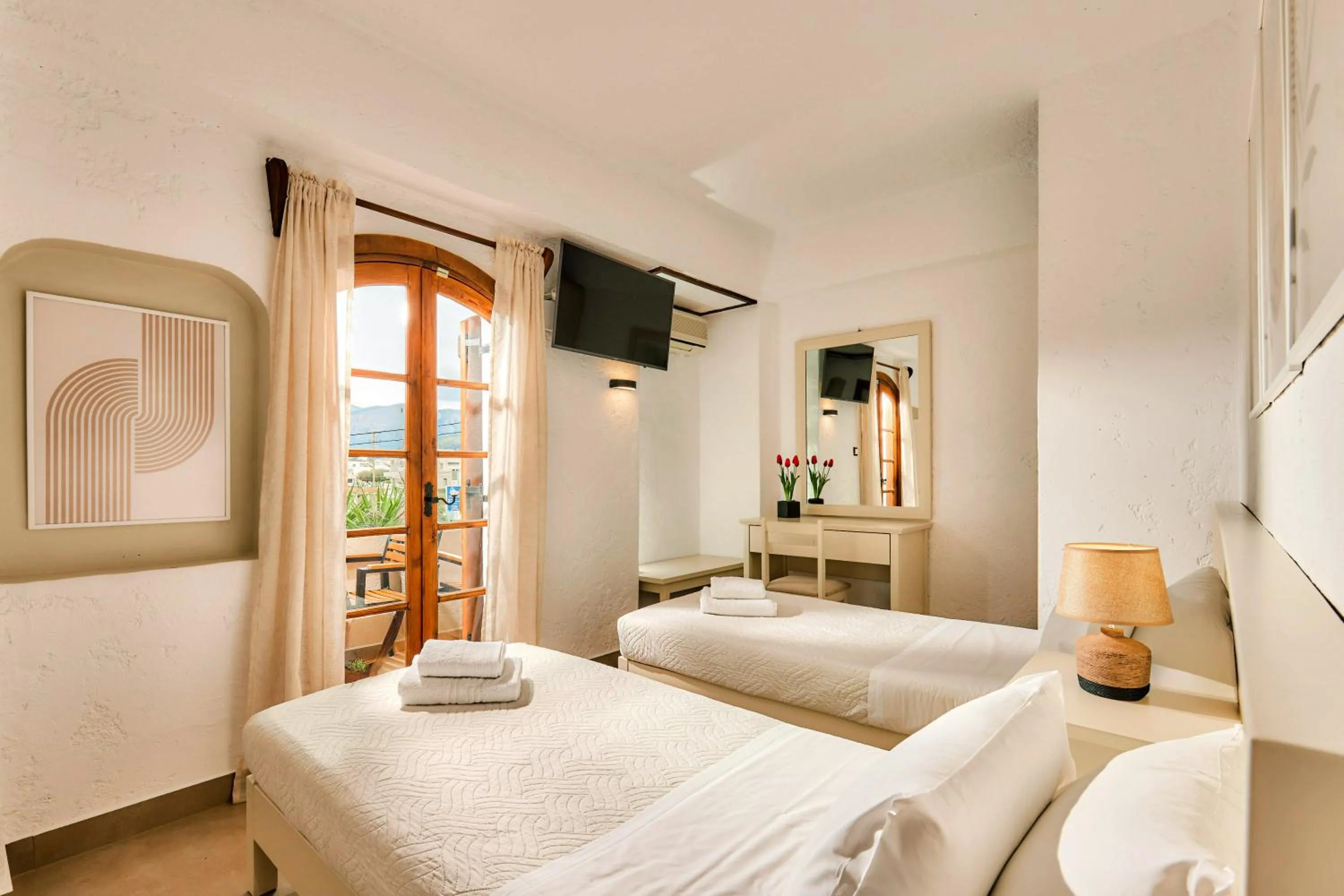 Bed in Mila Malia Studios Hotel