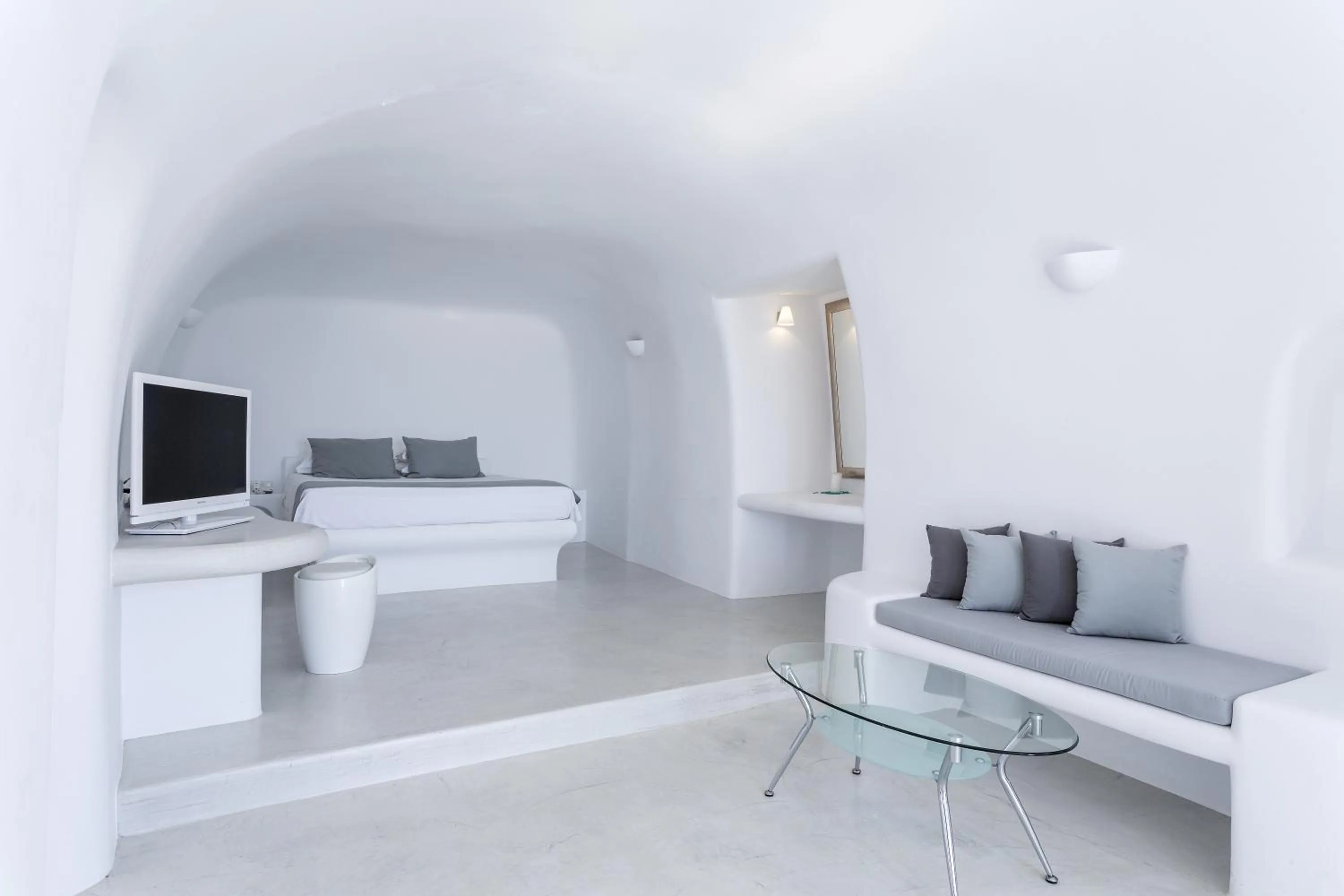 Seating area, Bed in Pegasus Suites & Spa