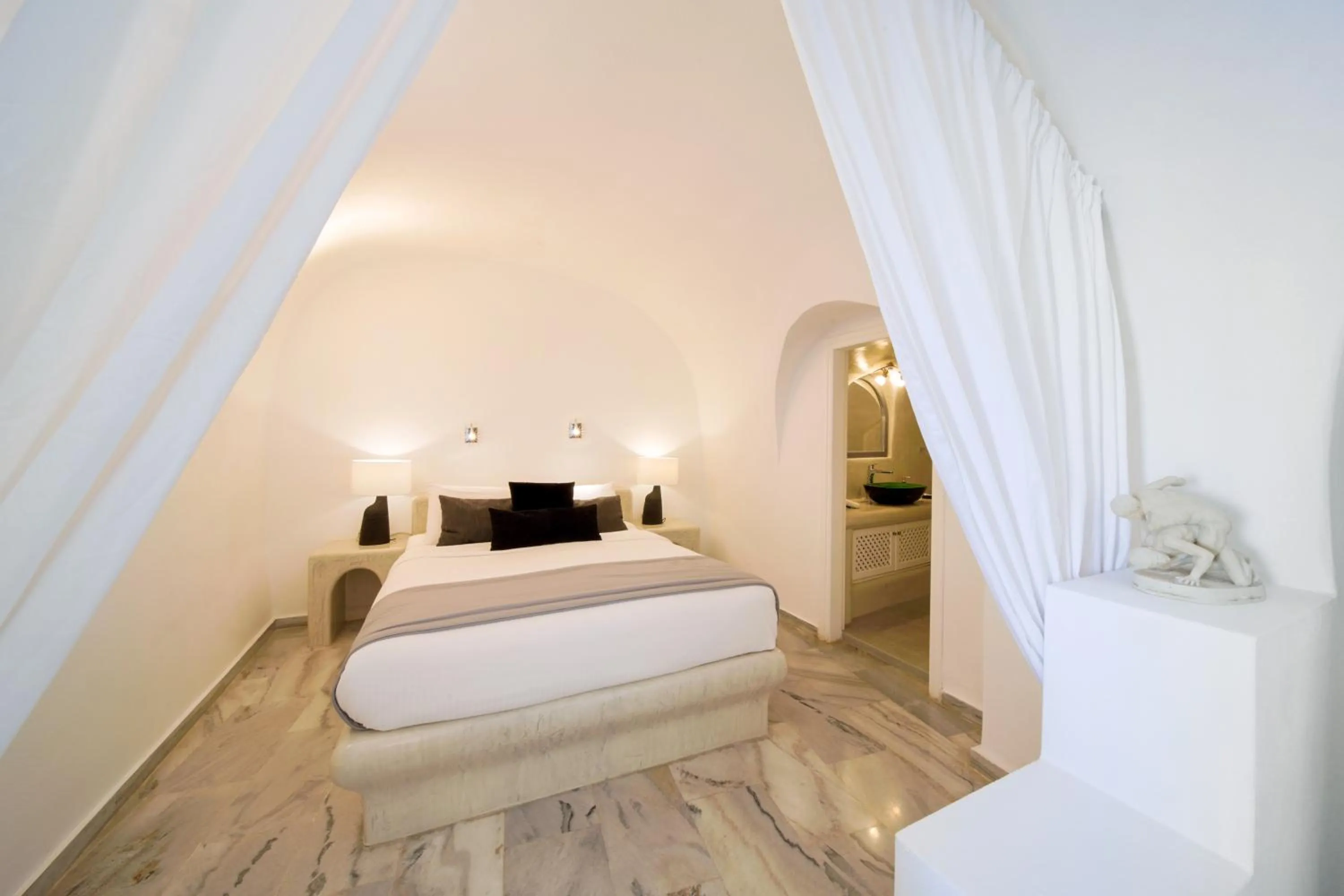 Bed in Pegasus Suites & Spa