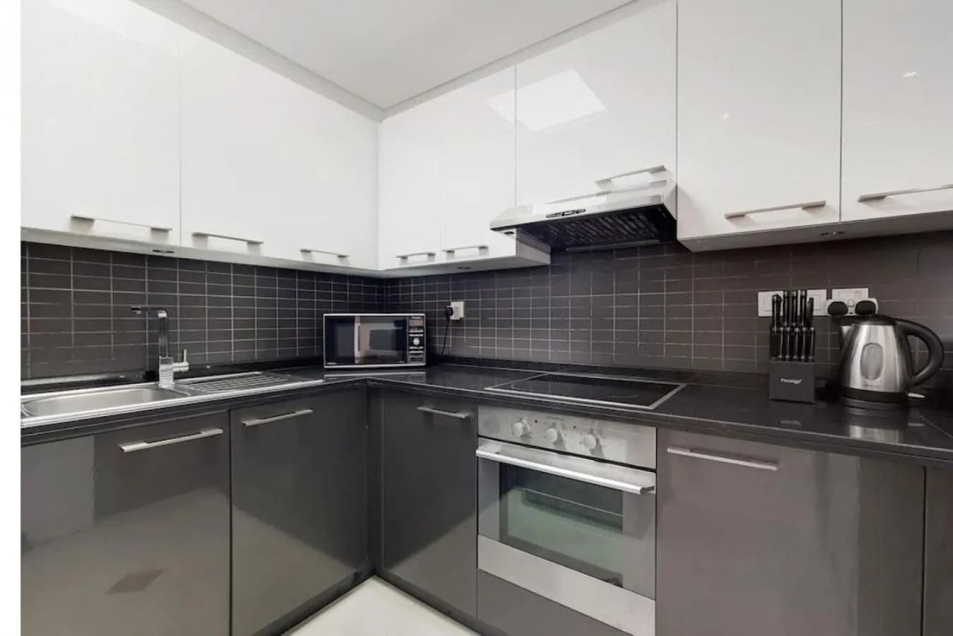 Kitchen or kitchenette in Silverene Tower B, Dubai Marina - Vibrant Two Bedroom