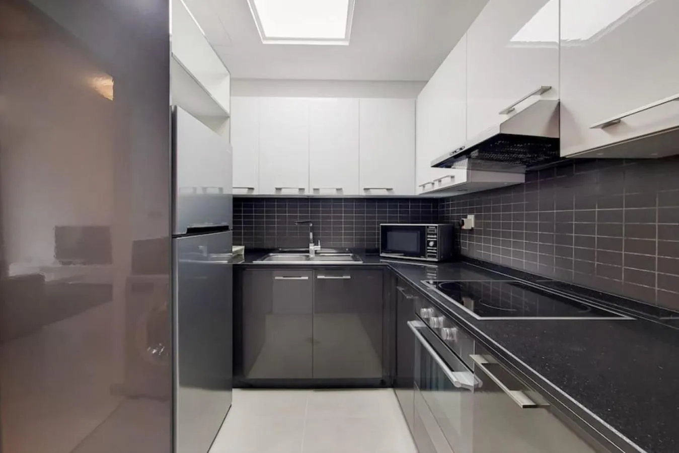 Kitchen or kitchenette in Silverene Tower B, Dubai Marina - Vibrant Two Bedroom